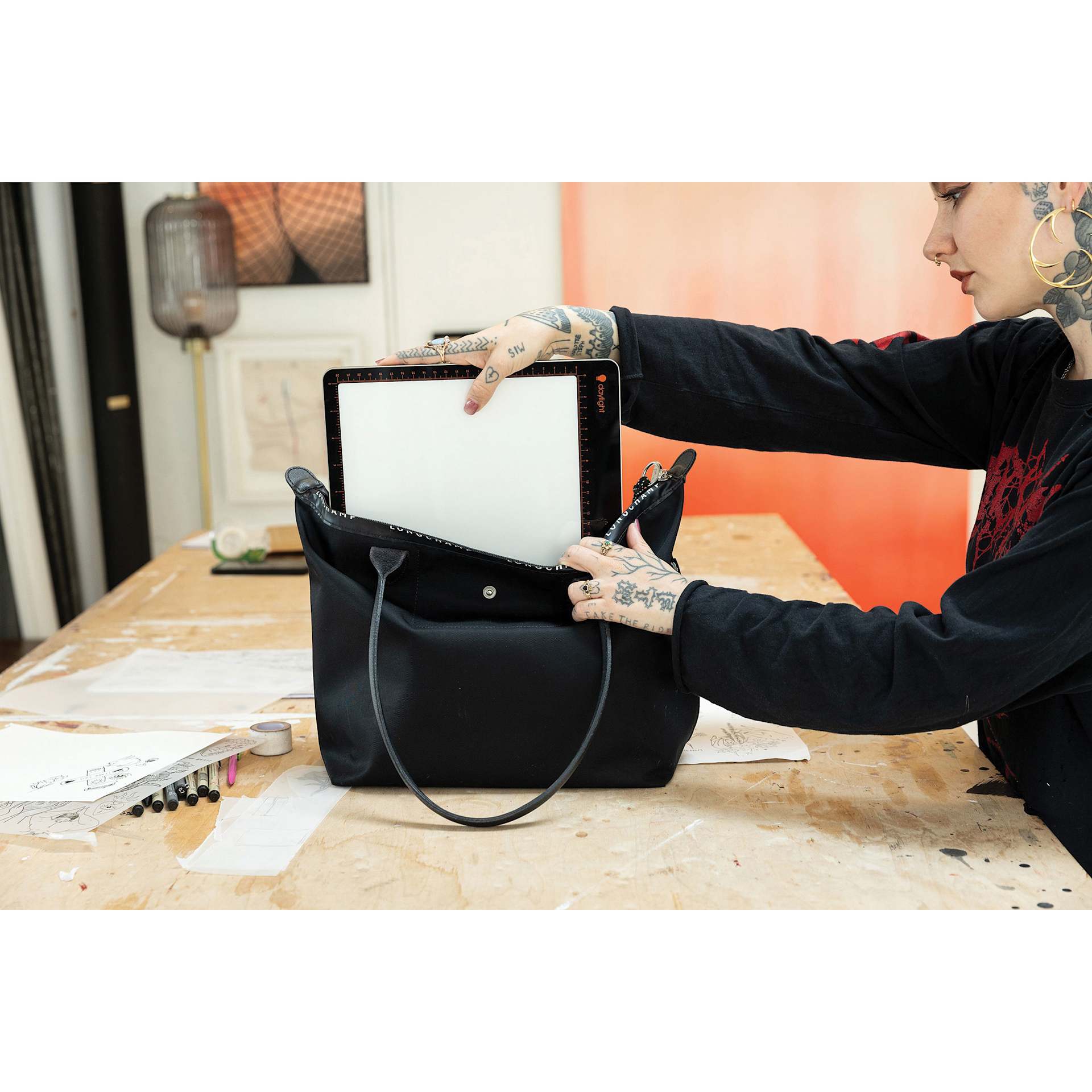 Daylight Tabla Go Rechargeable Light Pad - placed in a tote bag