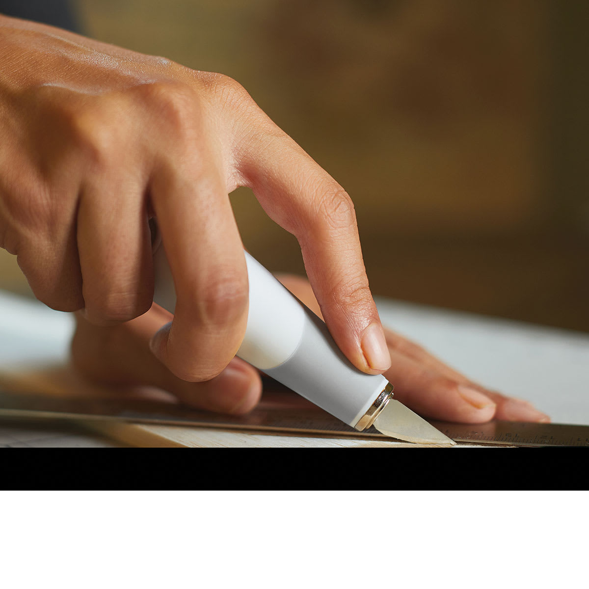 Fiskars Craft Knife Kit - Closeup of Hand using Heavy-Duty Knife on paper