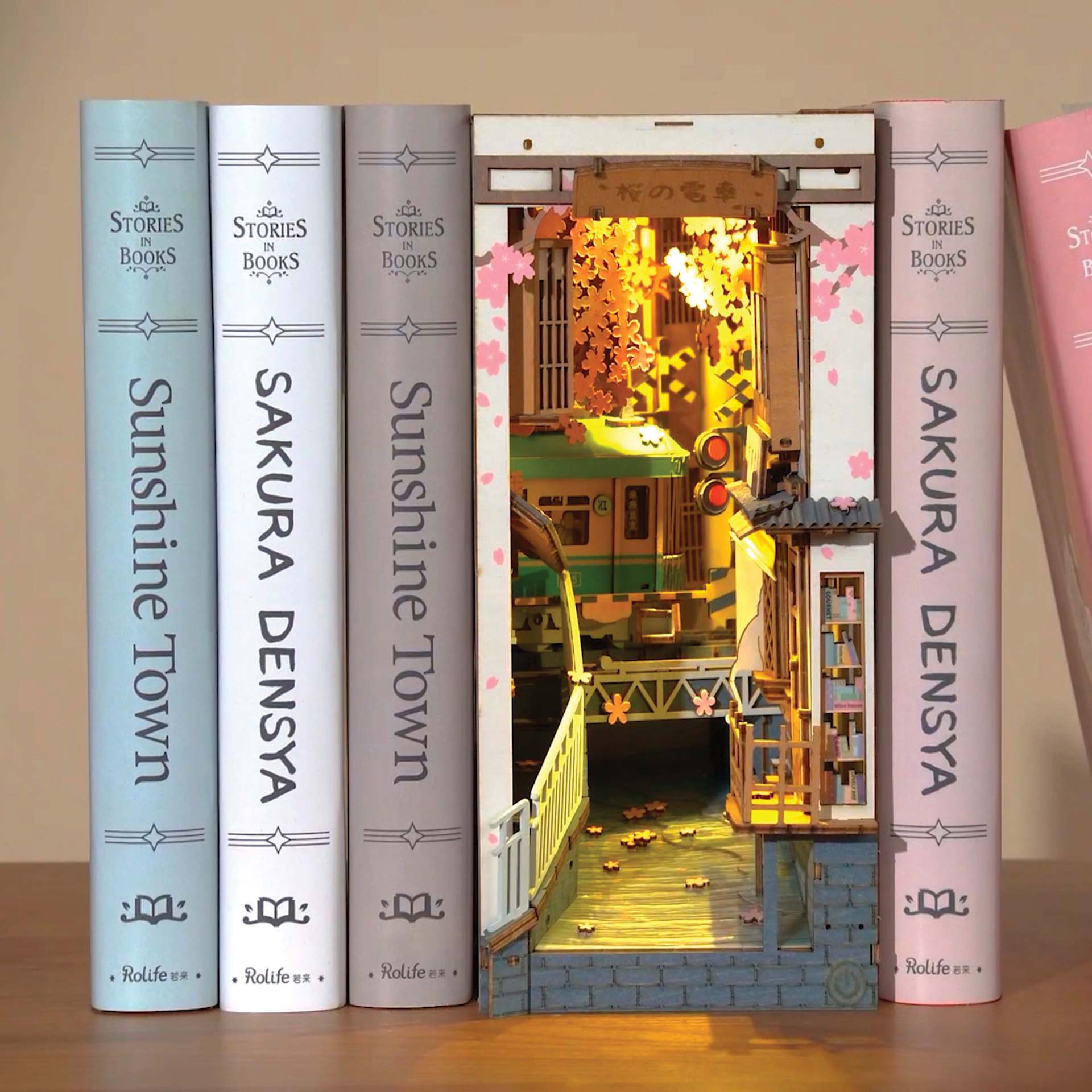 Rolife Sakura Densya DIY Book Nook Kit, constructed kit between books