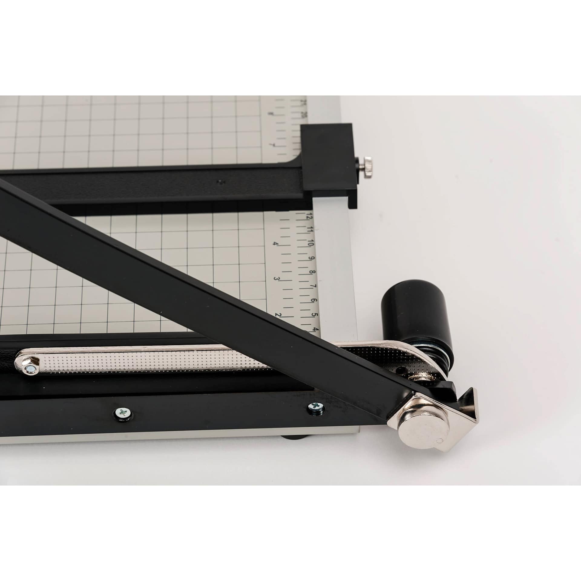 Dahle Paper Trimmer - 12" Cutting Length, 19-3/4" x 10-1/4", close-up of the spring action blade