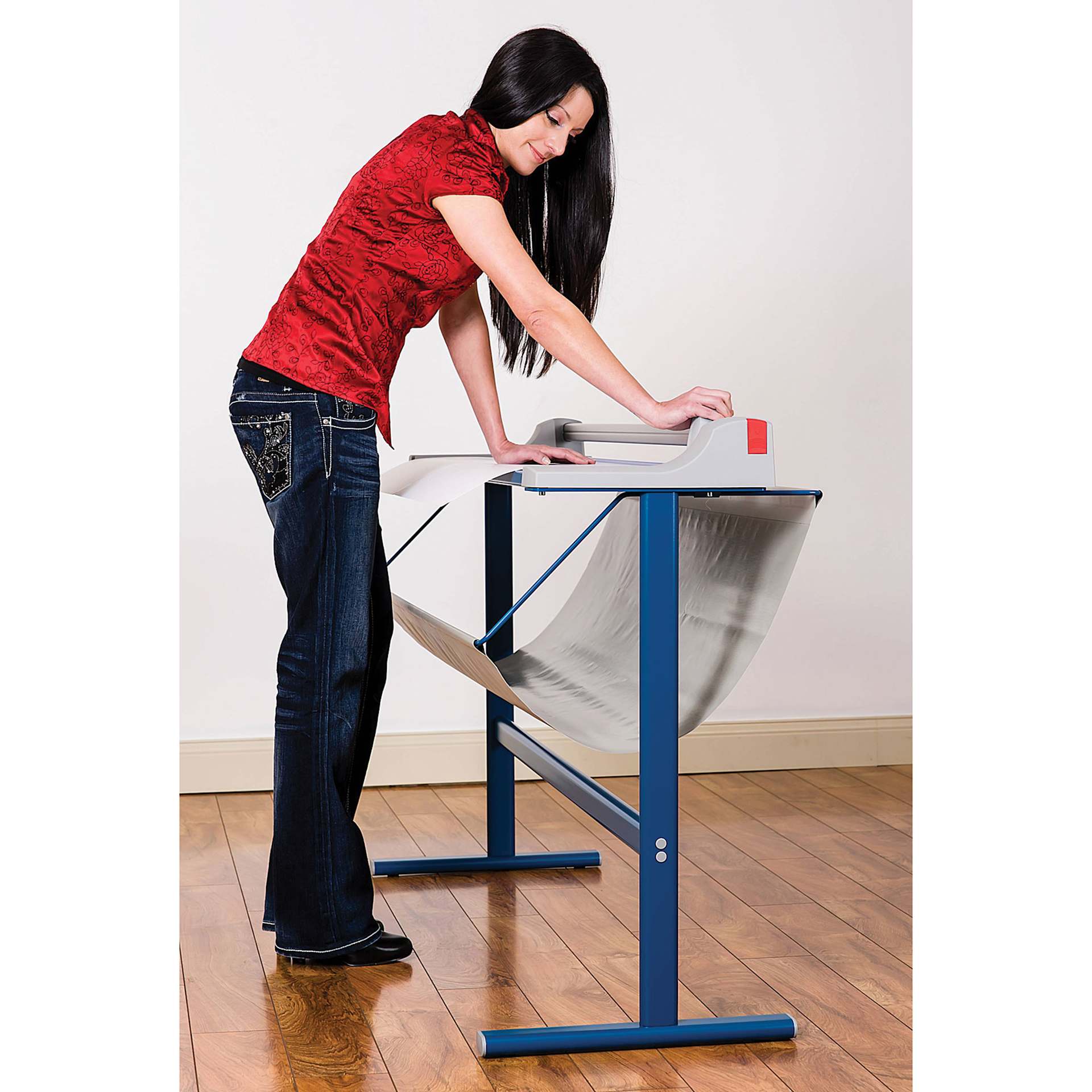 Dahle Large Format Premium Rotary Trimmer - 36" Cutting Length, adult next to trimmer on stand