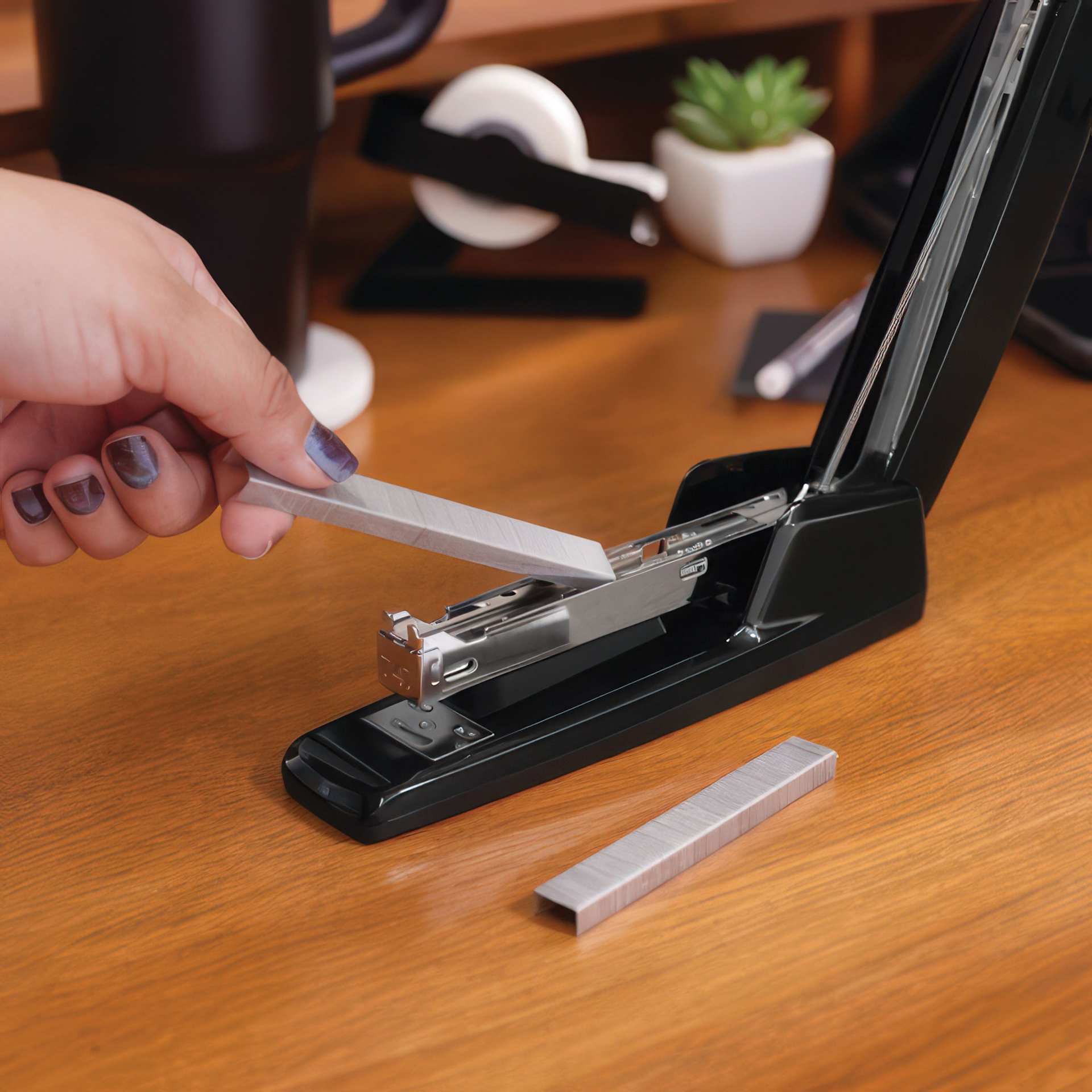 Swingline 747 Antimicrobial Business Stapler showing staples being inserted