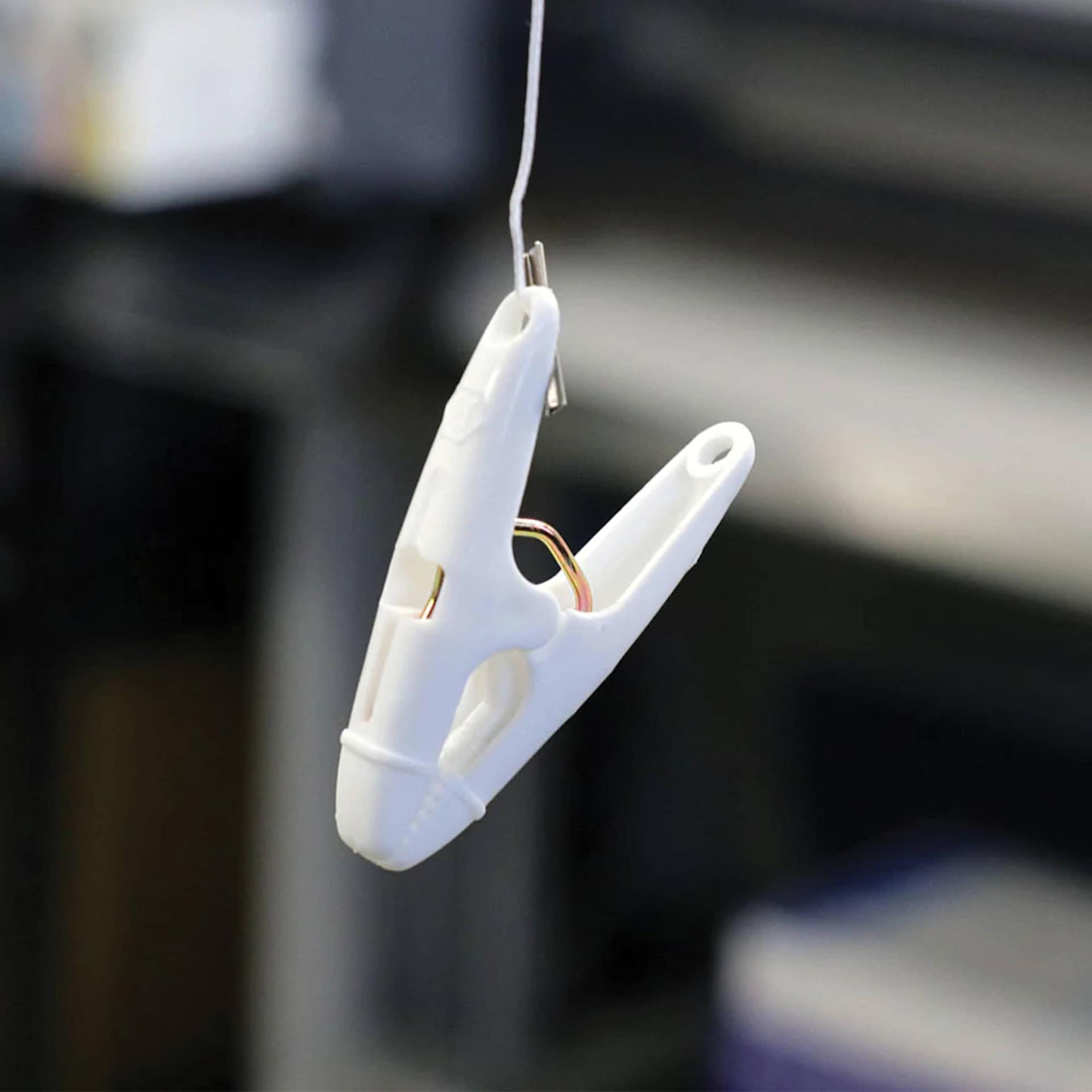StikkiWorks Grid Ceiling Hanglers Clothes Pin Clamps, demonstration of the hanging clamp. 