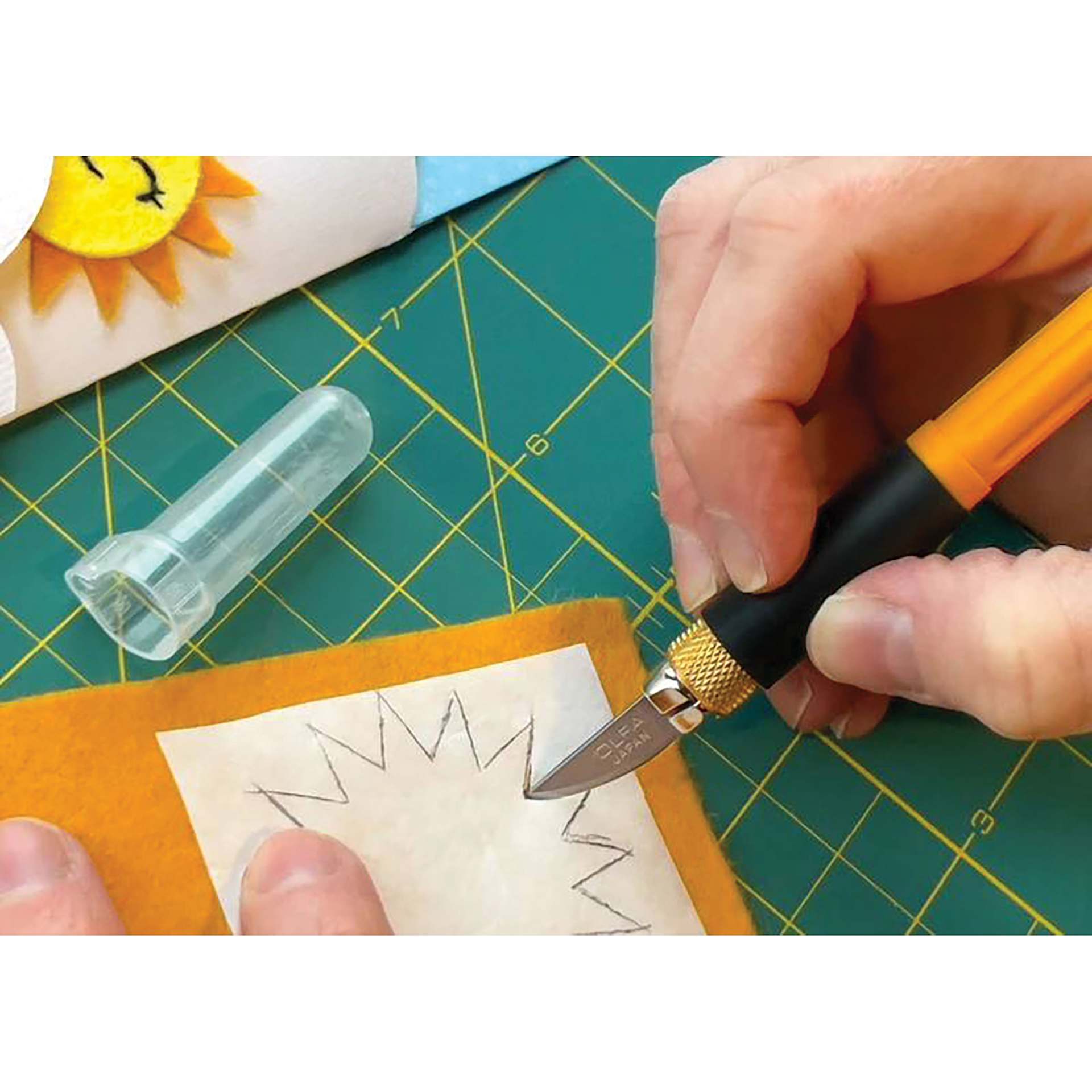 Olfa Curved Carving Art Blade - cutting a paper sun