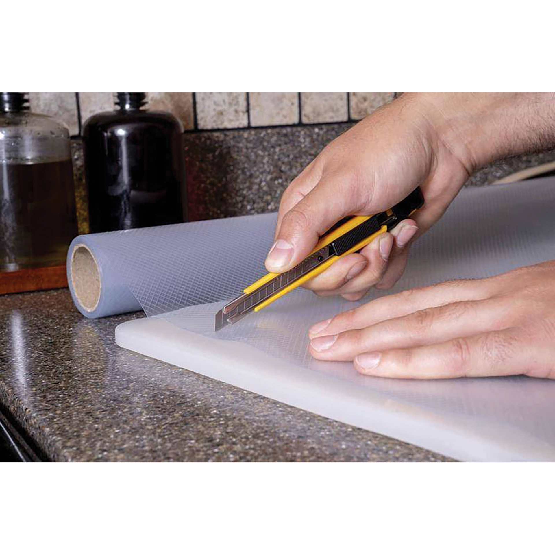 Olfa Slide-Lock Precision Utility Knife cutting plastic sheet