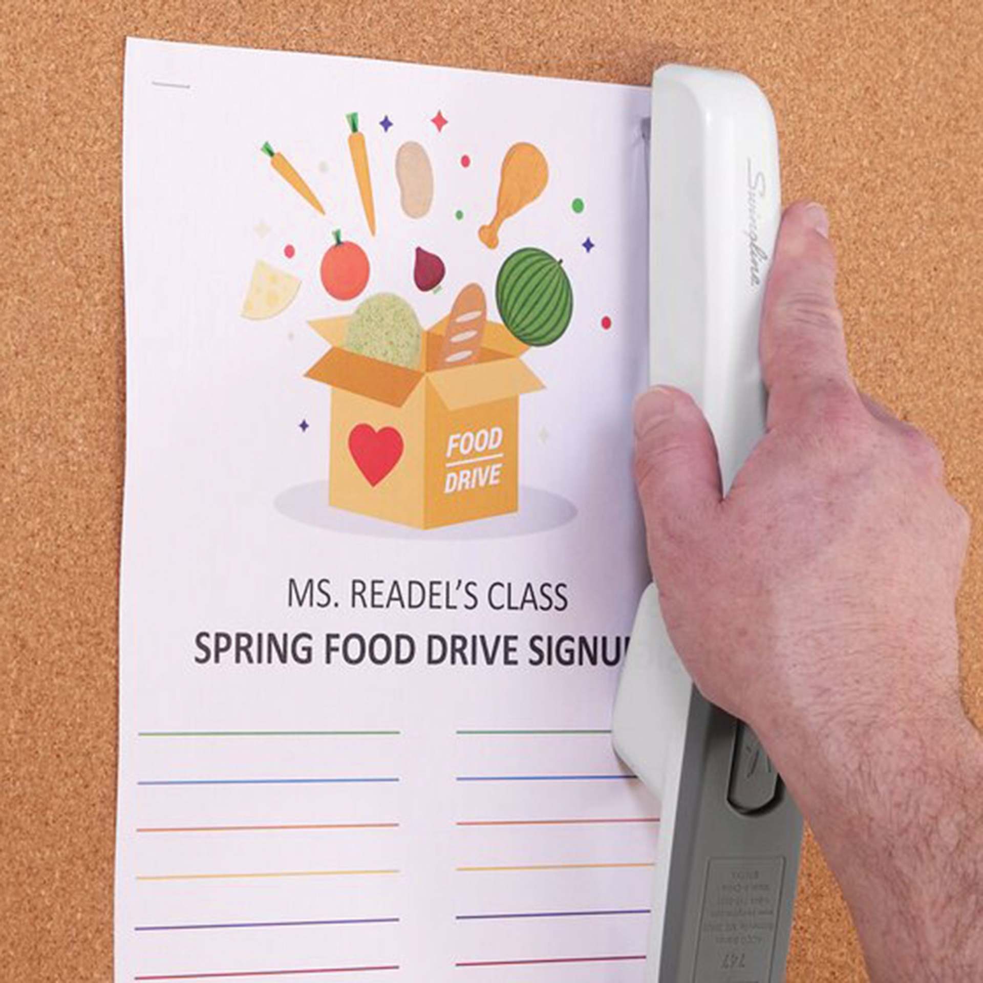 Swingline 747 Business Stapler - Arctic White stapling paper to bulletin board