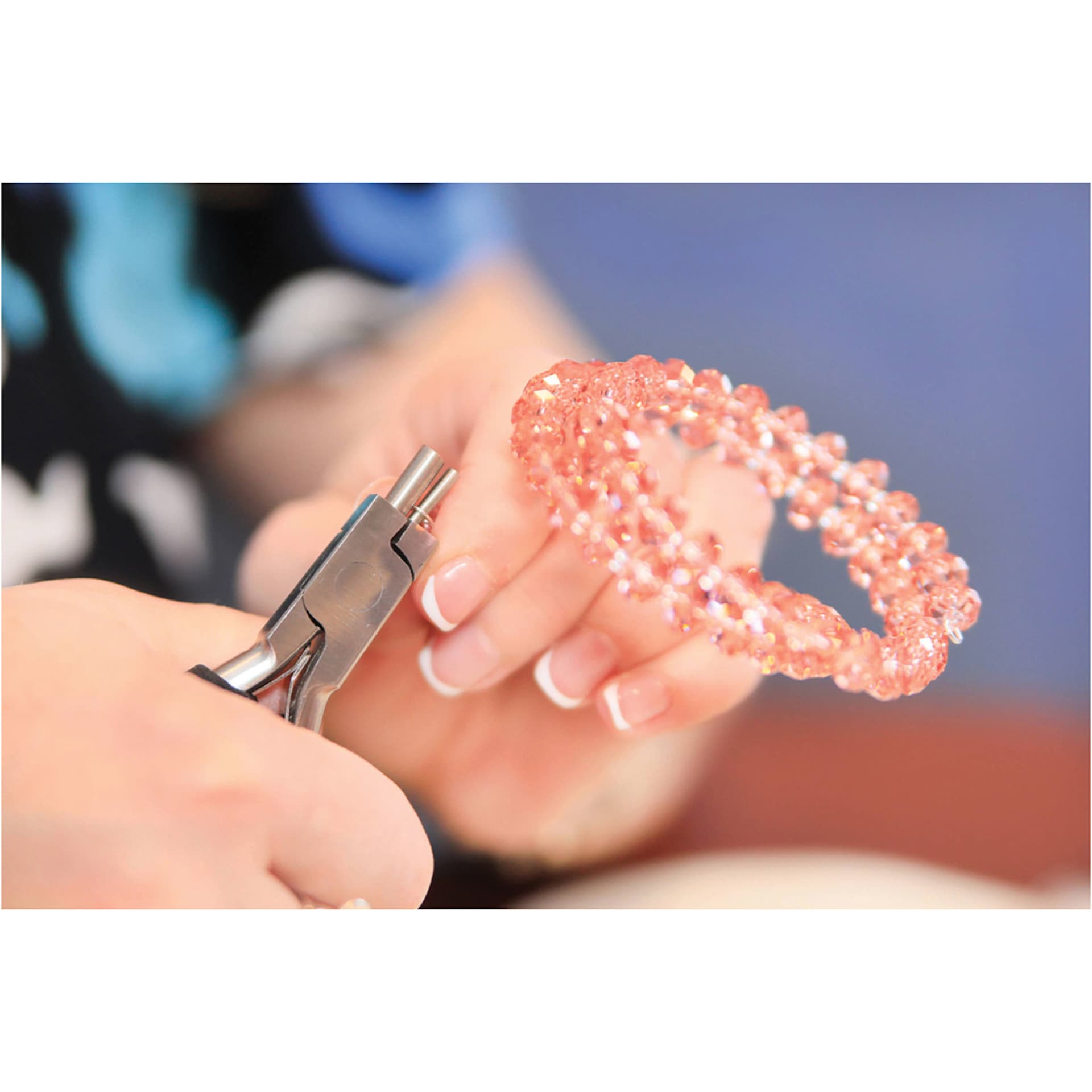 Beadalon Memory Wire Finishing Pliers in use at table close-up with finished project example