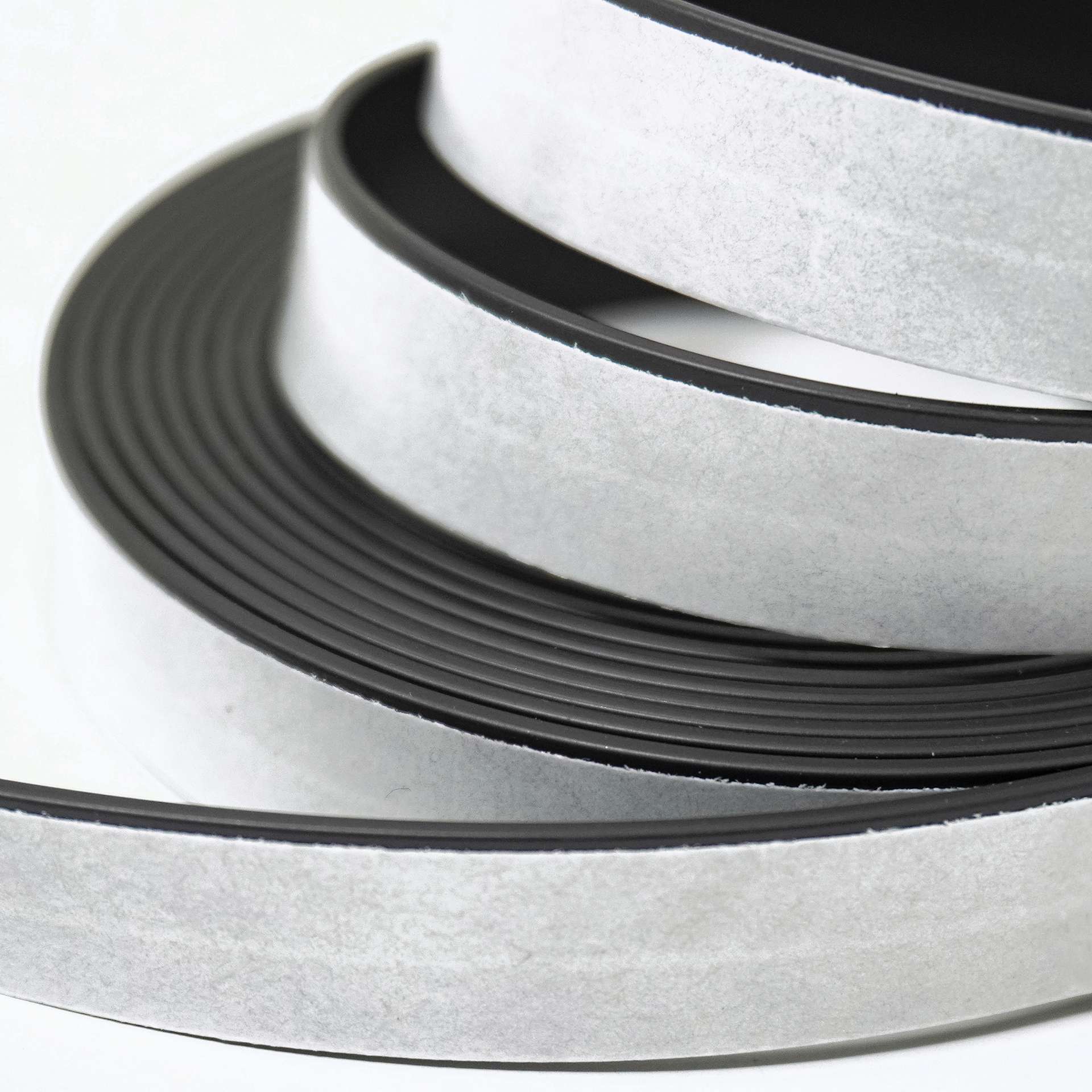 ProMag Adhesive Magnetic Tape Roll - 1/2" x 25 ft close up to show adhesive side