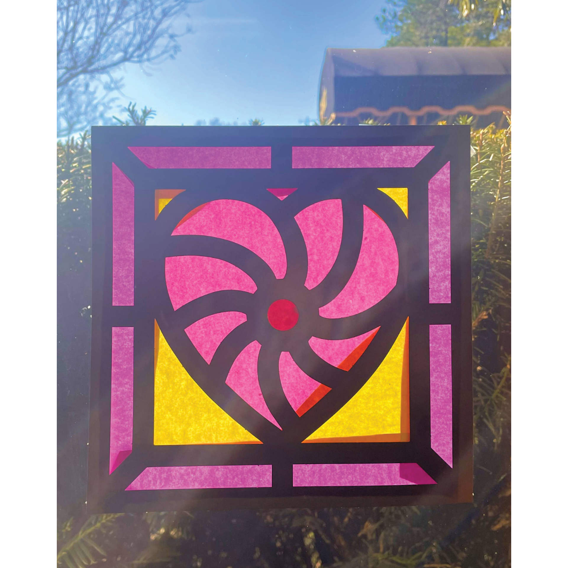 Roylco Stained Glass Frames Pack - Hearts, finished artwork on a window