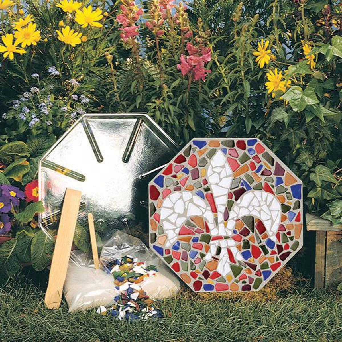 Mosaic Stepping Stone Kit Components of kit shown with completed fleur de lis mosaic 