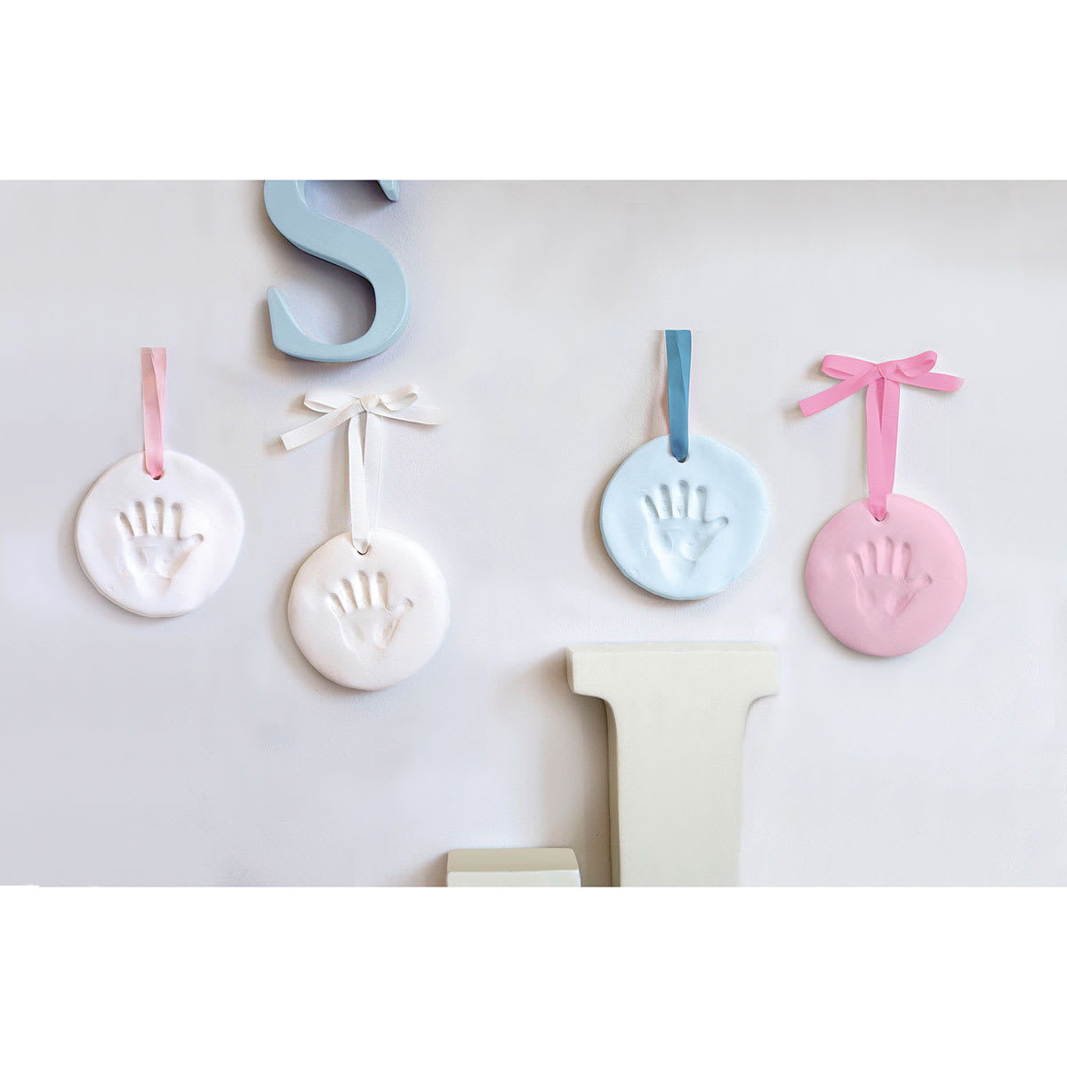 Pearhead Babyprints Keepsake - Four Keepsakes on Wall
