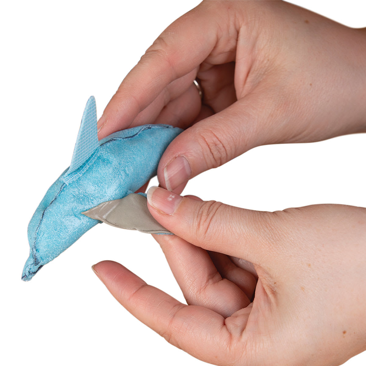 Thibra Fine Sculptable Plastic - Hands holding small plastic Dolphin