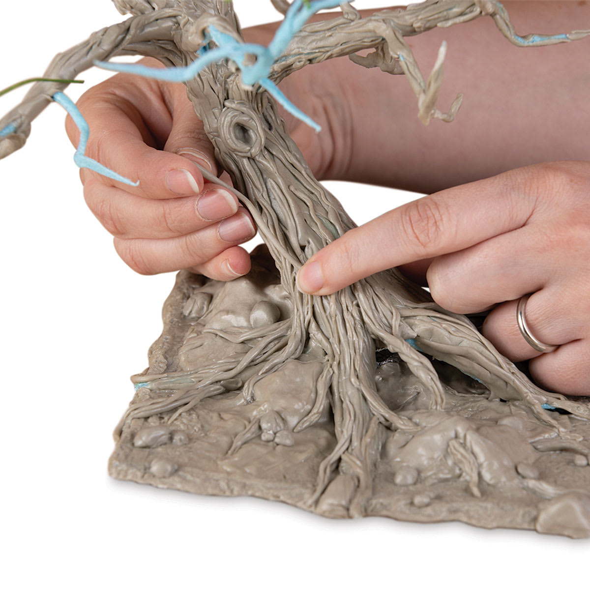 Thibra Fine Sculptable Plastic - Person using Plastic to form Tree bark and roots