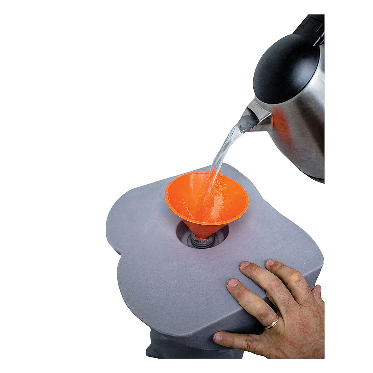 The Monster Makers Premium Armature - Hot water being poured into bust with funnel