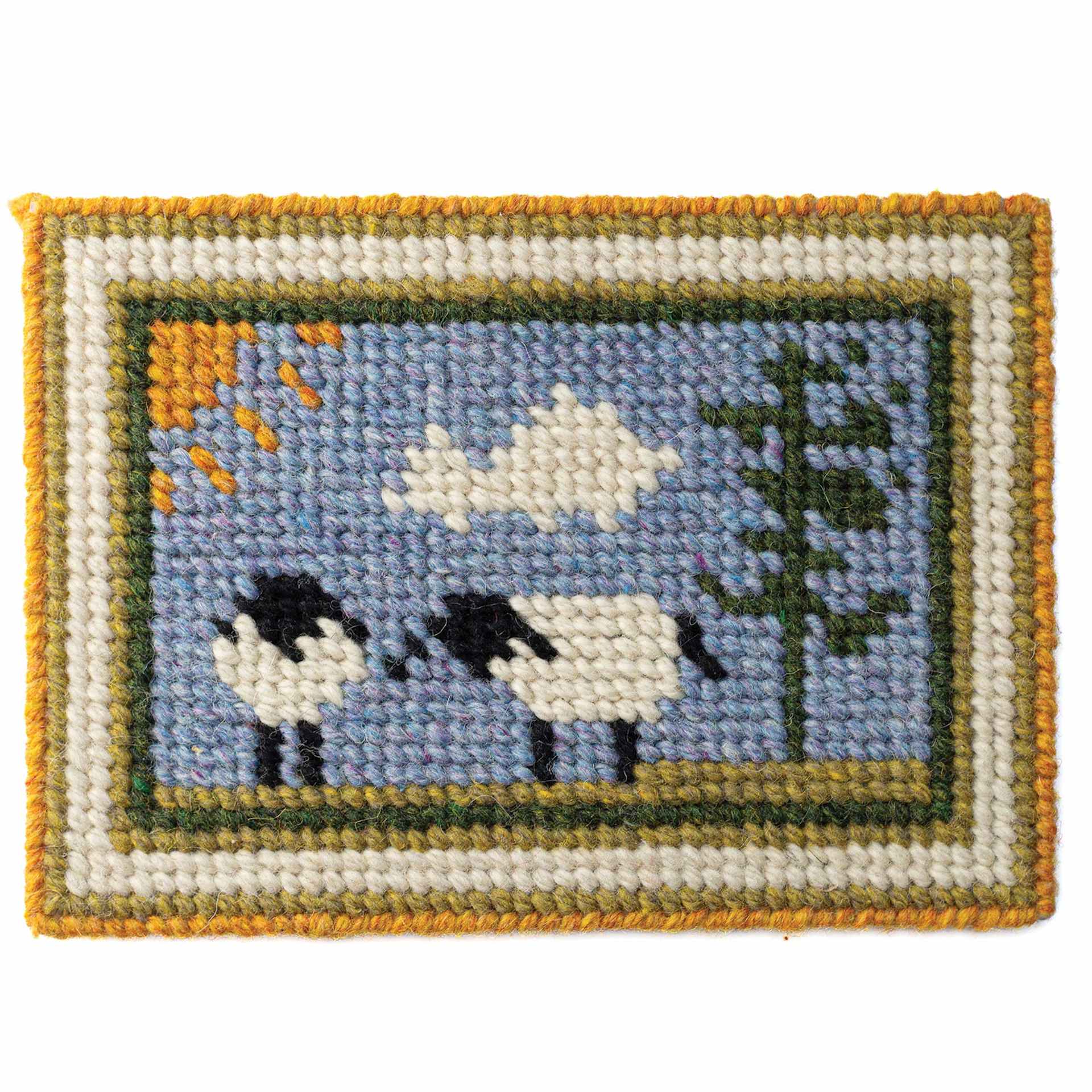 Friendly Loom Explore Needlepoint Homestead Kit showing completed sheep design project