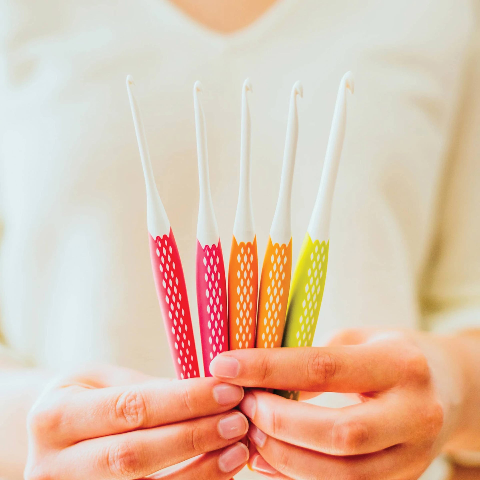 Prym Ergonomics Crochet Hook Sets - Small, Set of 5, being held.
