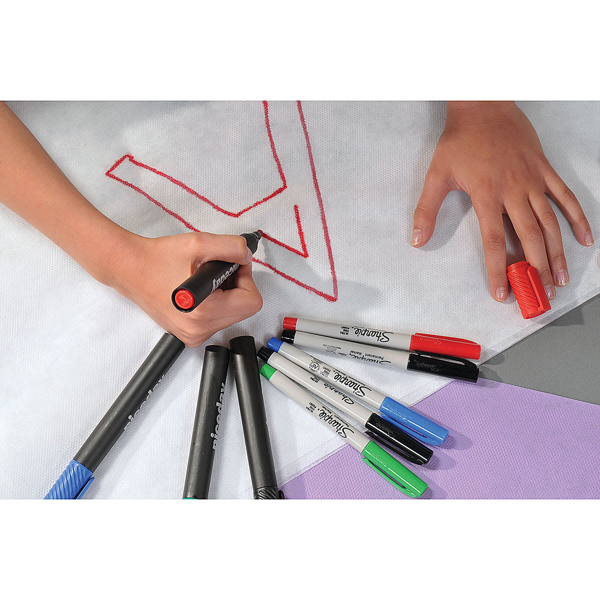 Smart-Fab Art and Decoration Fabric - Closeup of person using markers to write on fabric