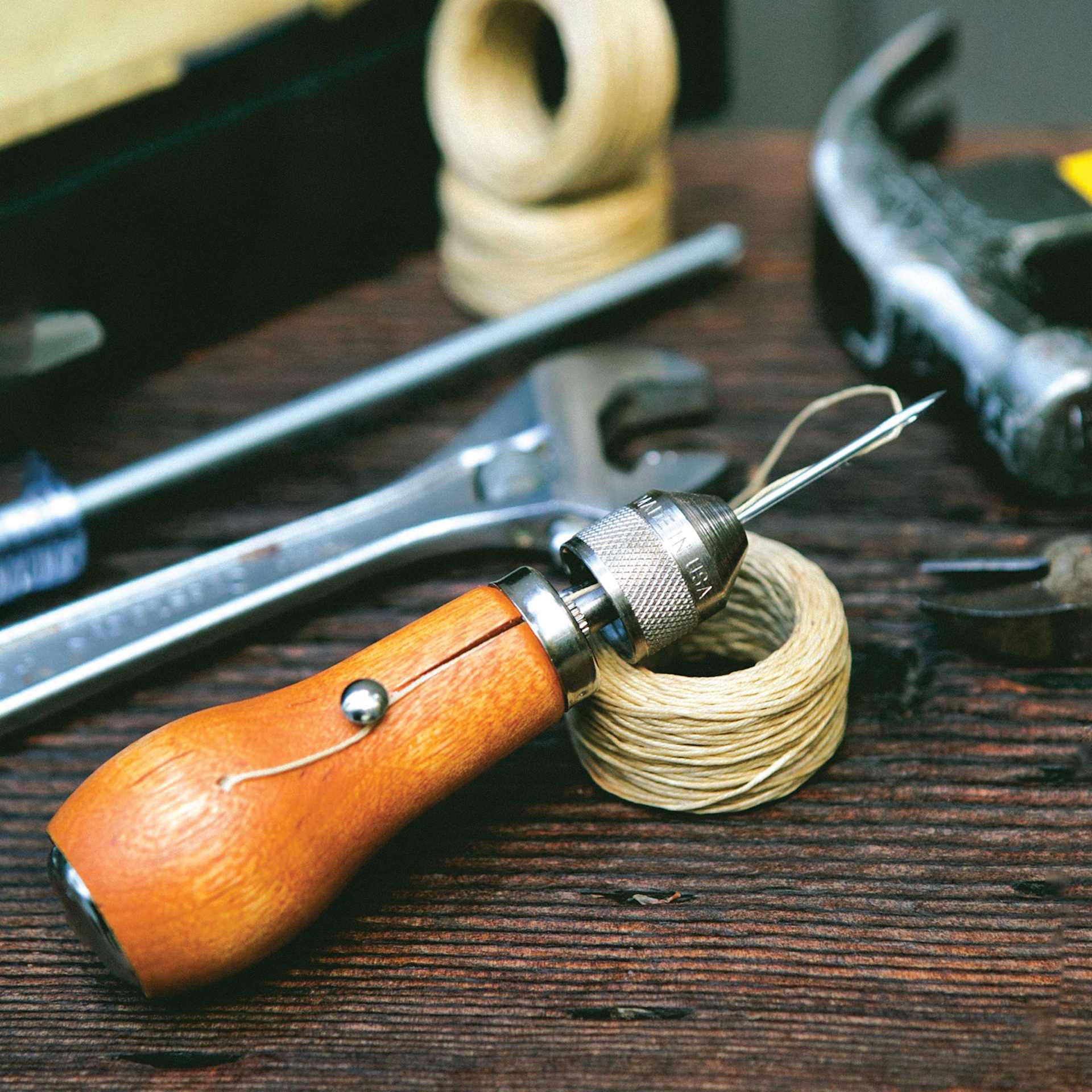 Speedy Stitcher Sewing Awl Kit, laid out next to other tools (not included)