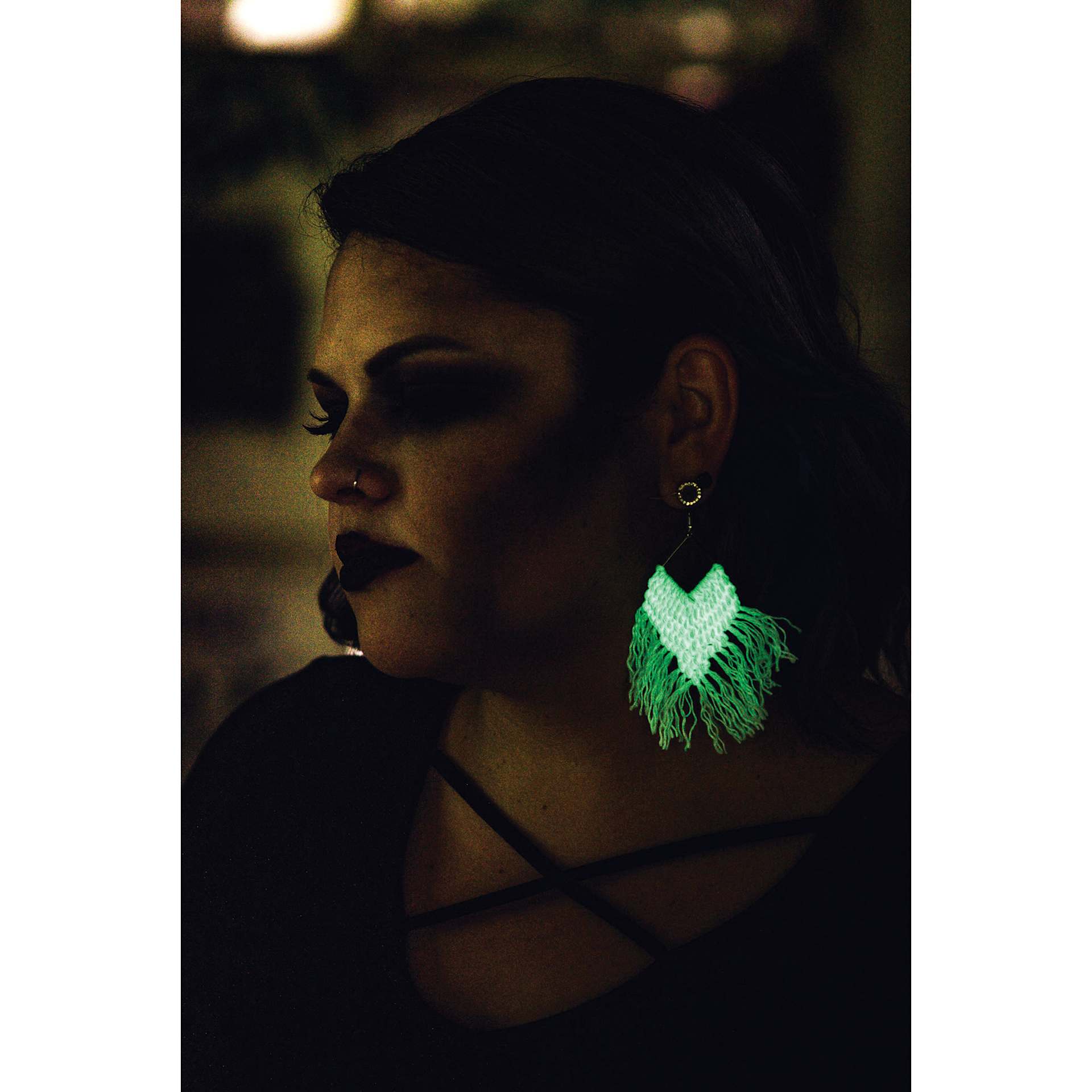 Lion Brand DIY Glow Yarn - person wearing glow in the dark earings