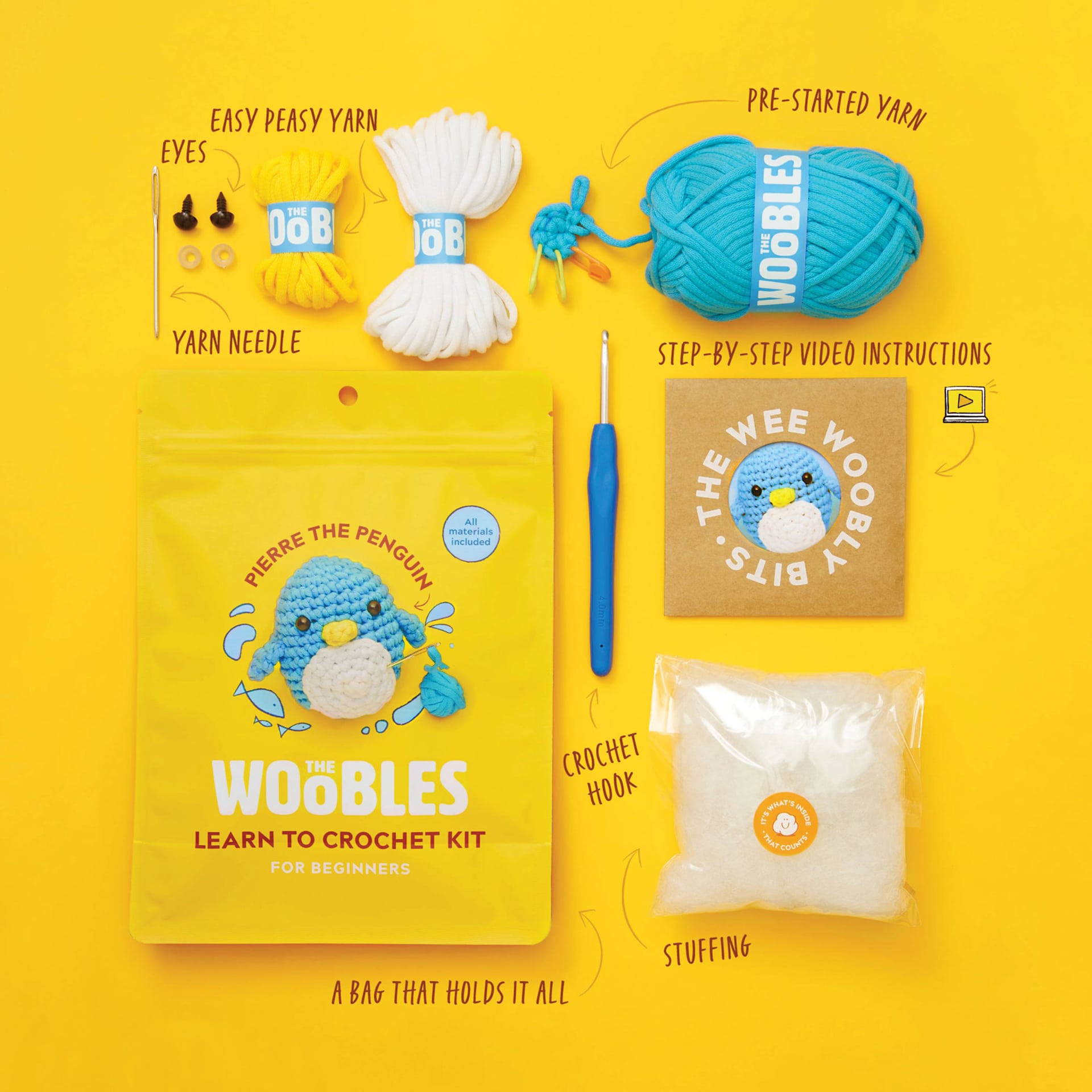 The Woobles Beginner Crochet Amigurumi Kits - Penguin (labelled kit contents with packaging top-view)