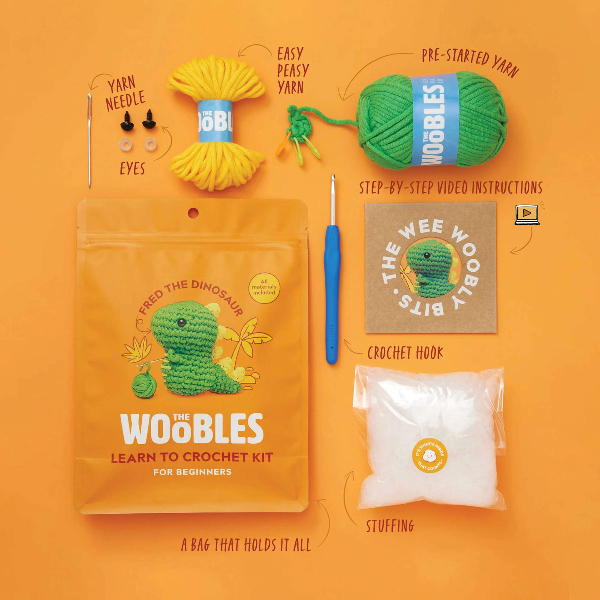 The Woobles Beginner Crochet Amigurumi Kit - Dinosaur, labelled kit contents and packaging