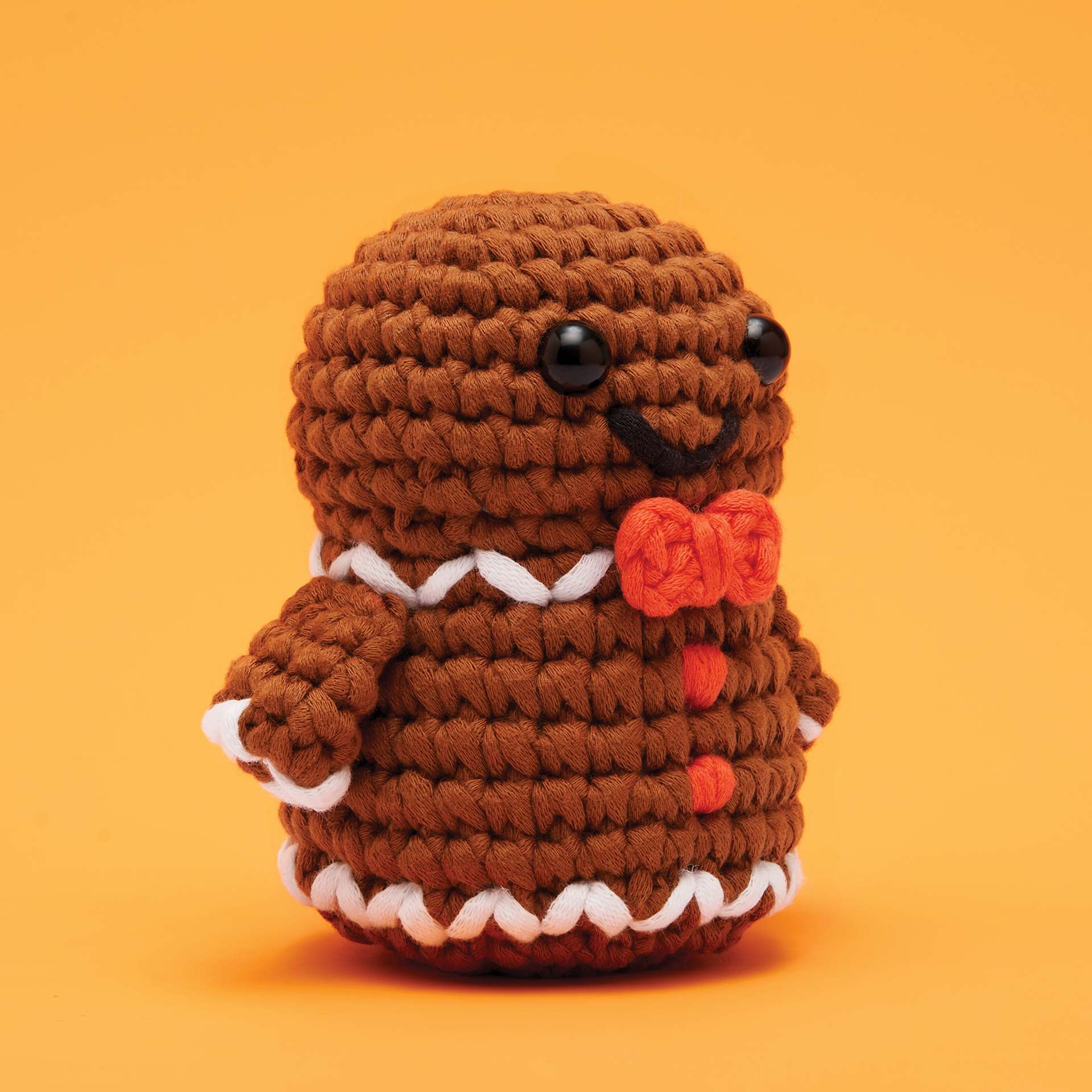 The Woobles Beginner Crochet Amigurumi Kit - Ted the Gingerbread Man, at an angle