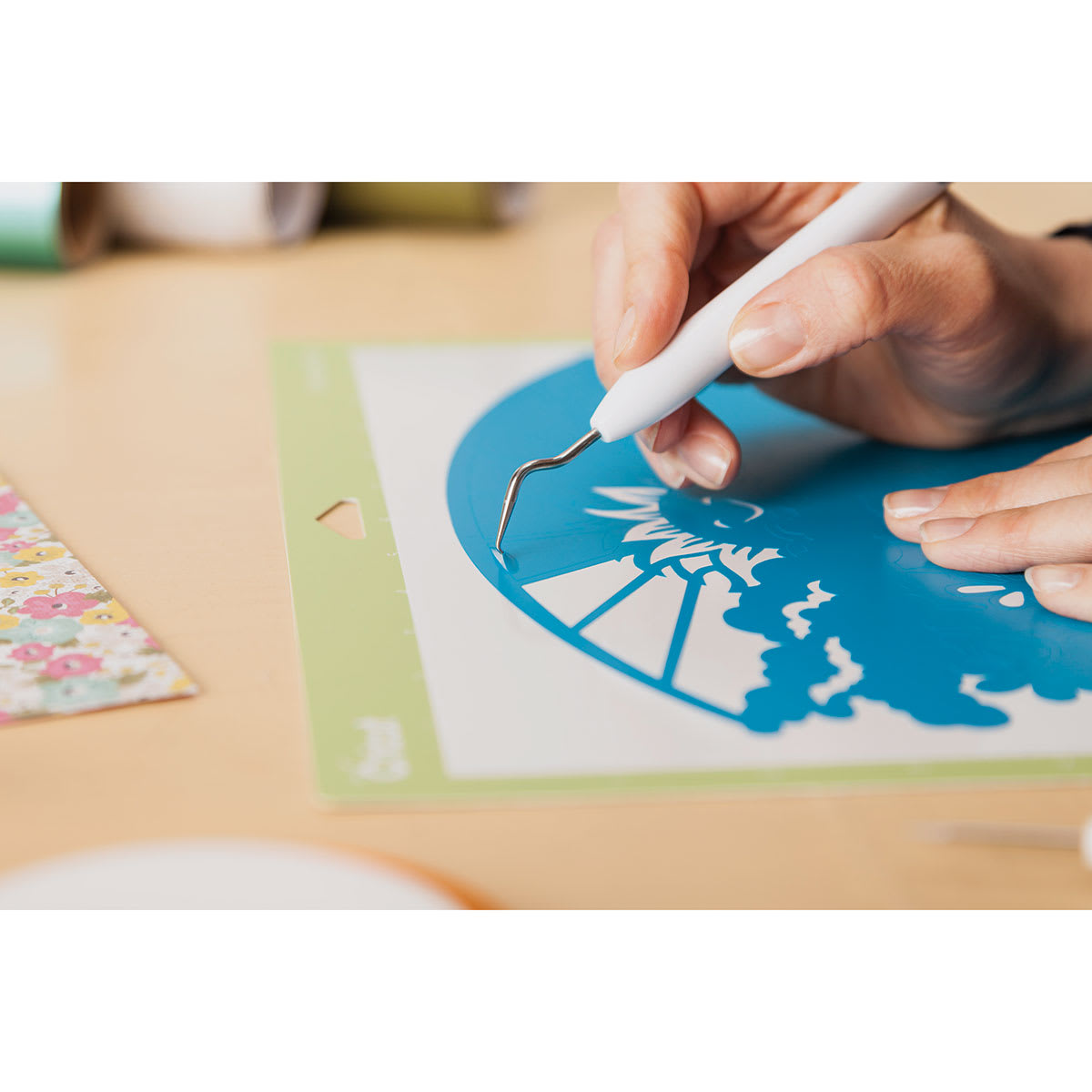 Cricut Weeding Tool Kit - Closeup of artist cutting vinyl out of picture with Angle Tip Weeder
