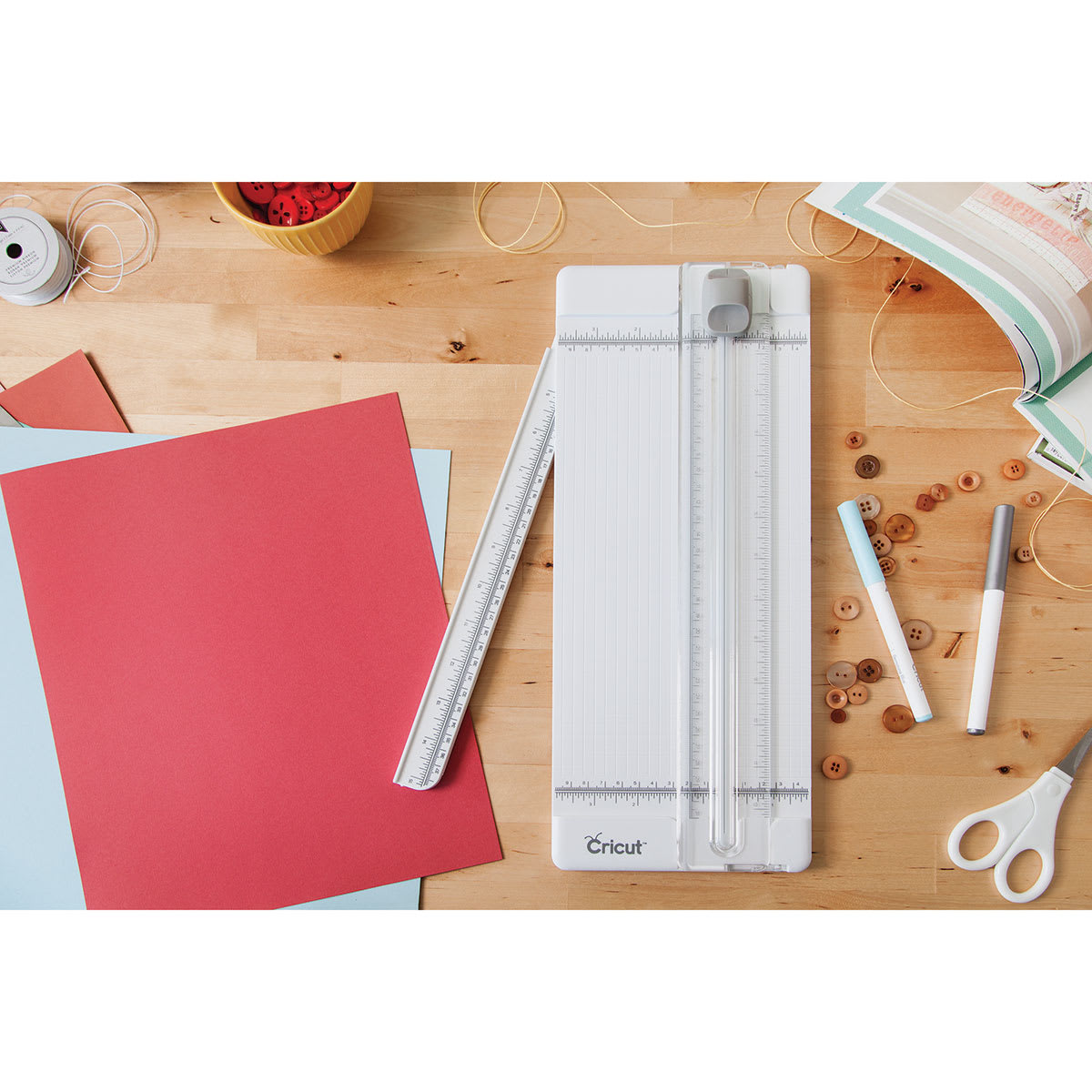 Cricut 12"” Essential Tool Set - Top view of Trimmer on table with swing out arm slightly extended
