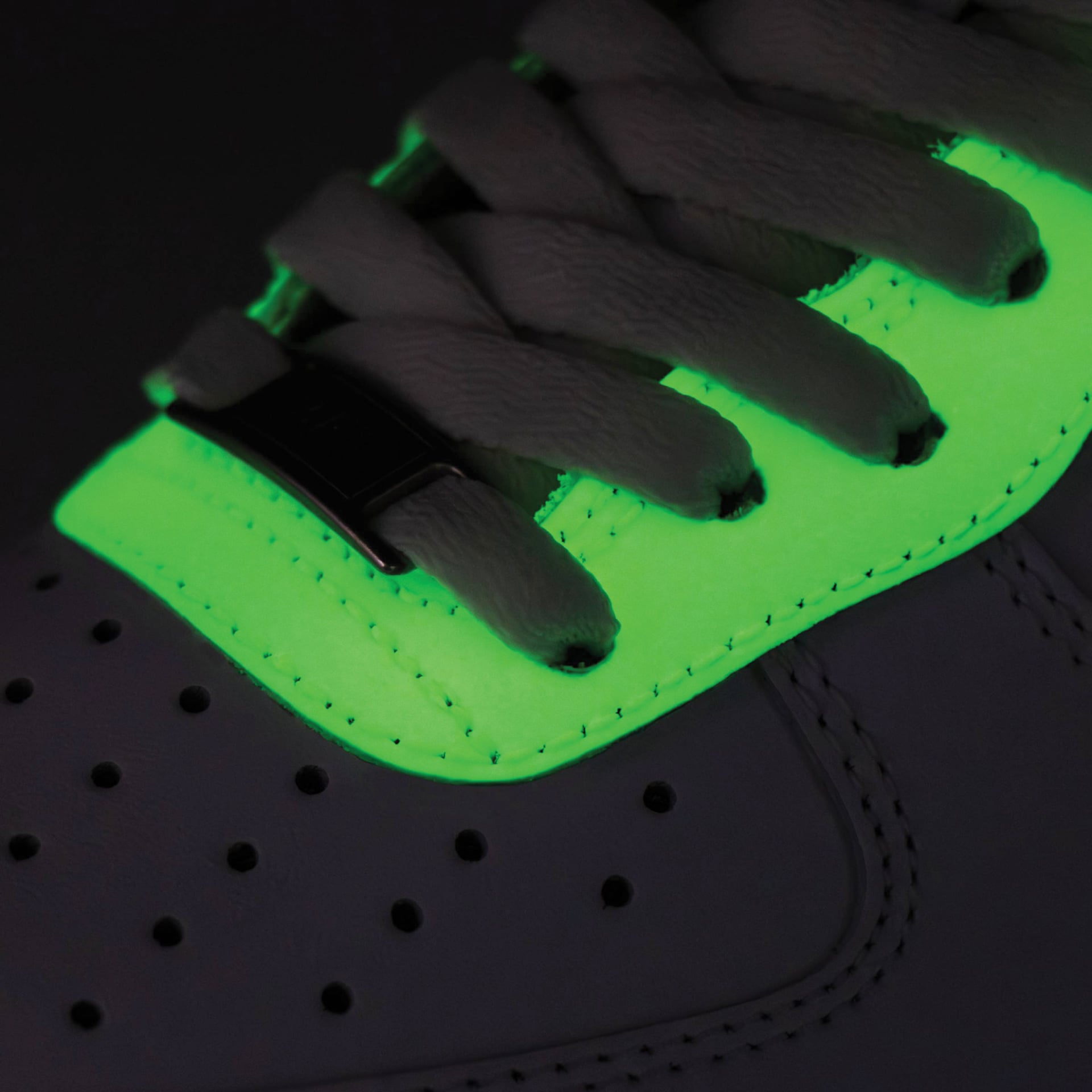Angelus Glow in the Dark Acrylic Paint - 1 oz - on shoe paint glowing in the dark, close-up