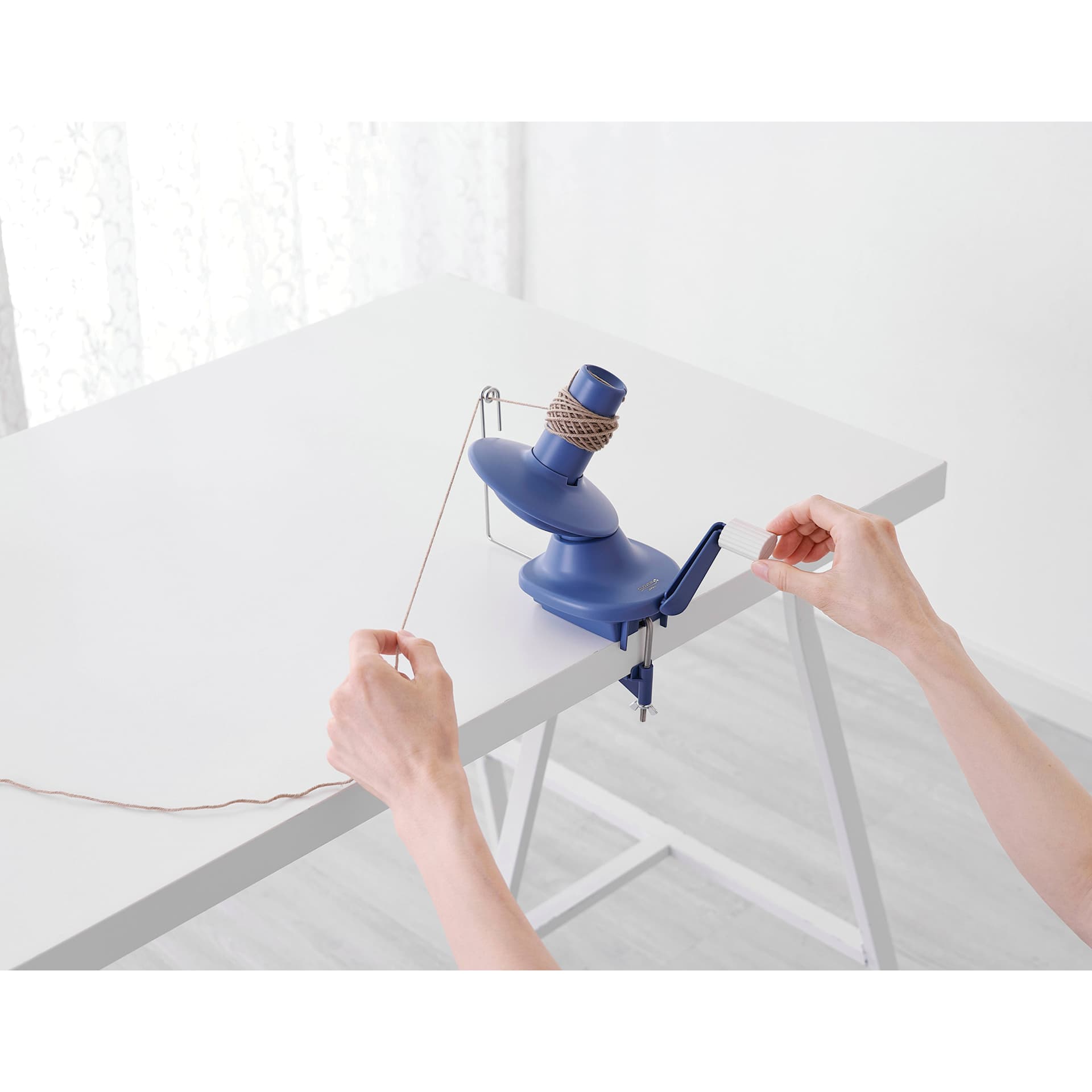 Clover Yarn Ball Winder - in use