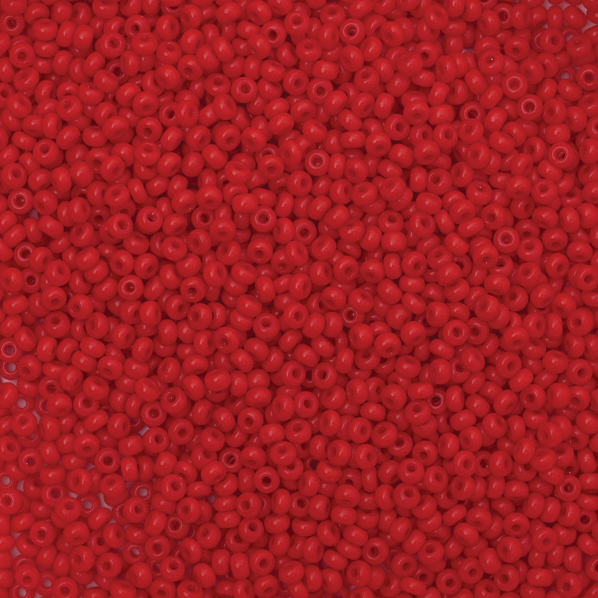 John Bead Czech Glass Seed Beads - Light Red, 10/0, 22 g Vial close up