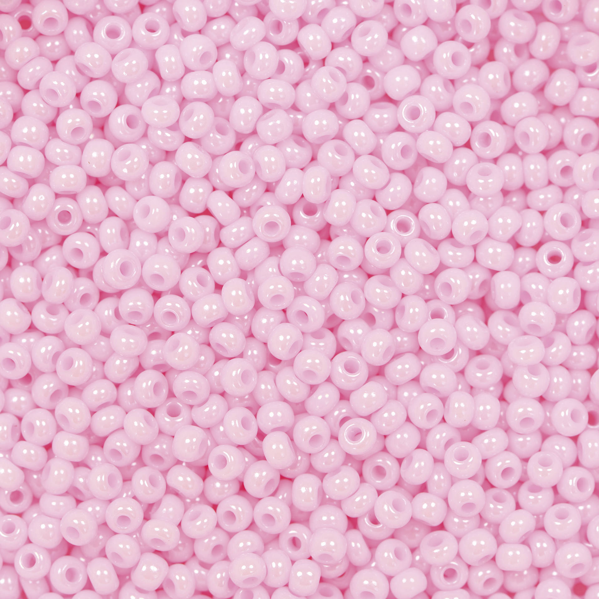John Bead Czech Glass Seed Beads - Dyed Pink, Opaque, 10/0, 22 g Vial close up