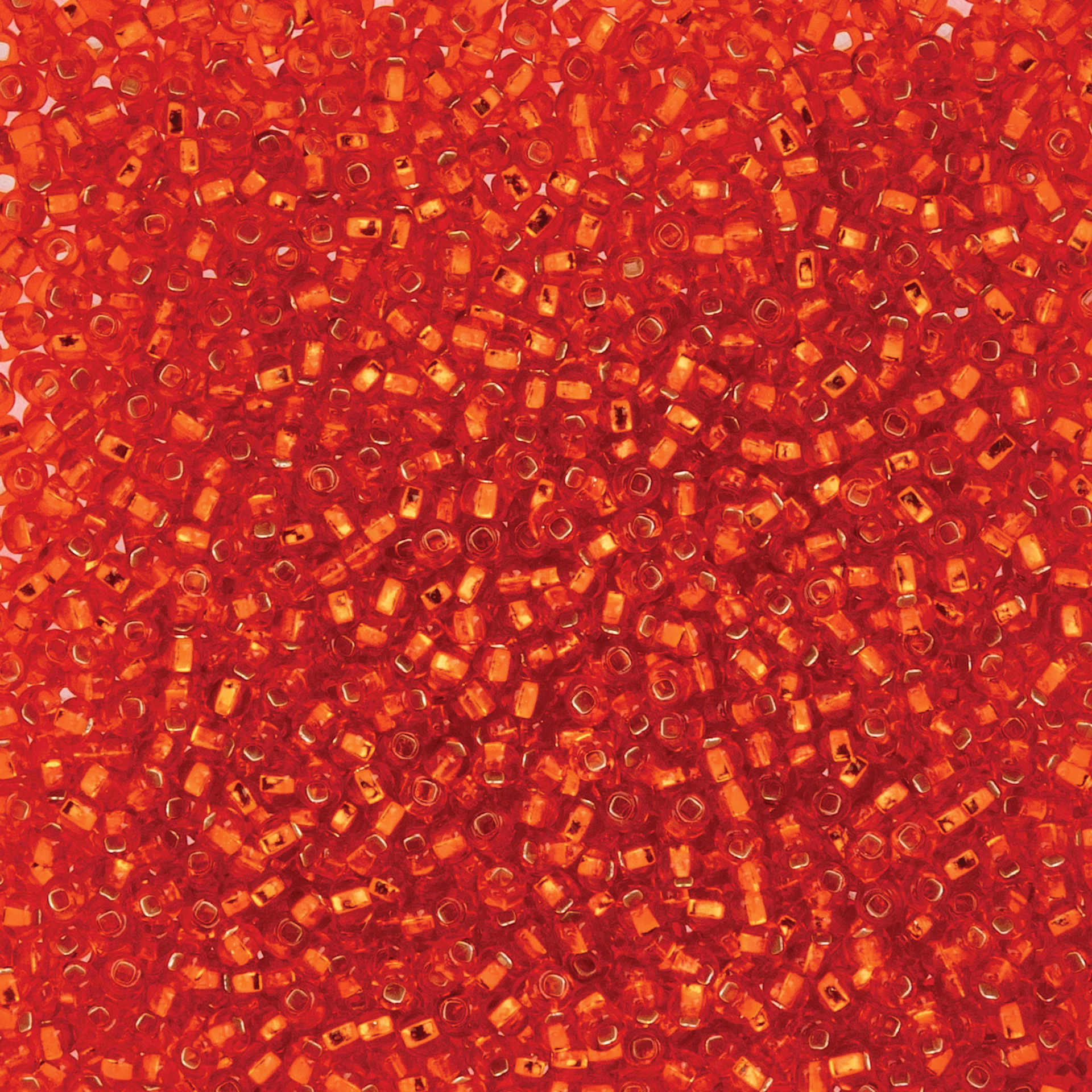 John Bead Czech Glass Seed Beads - Silver-Lined Orange, 10/0, 22 g Vial close up