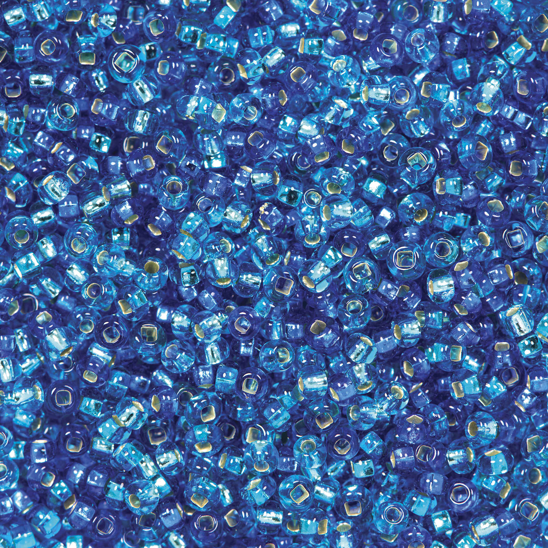 John Bead Czech Glass Seed Beads - Aqua, Silver Lined, 10/0 Vial close up