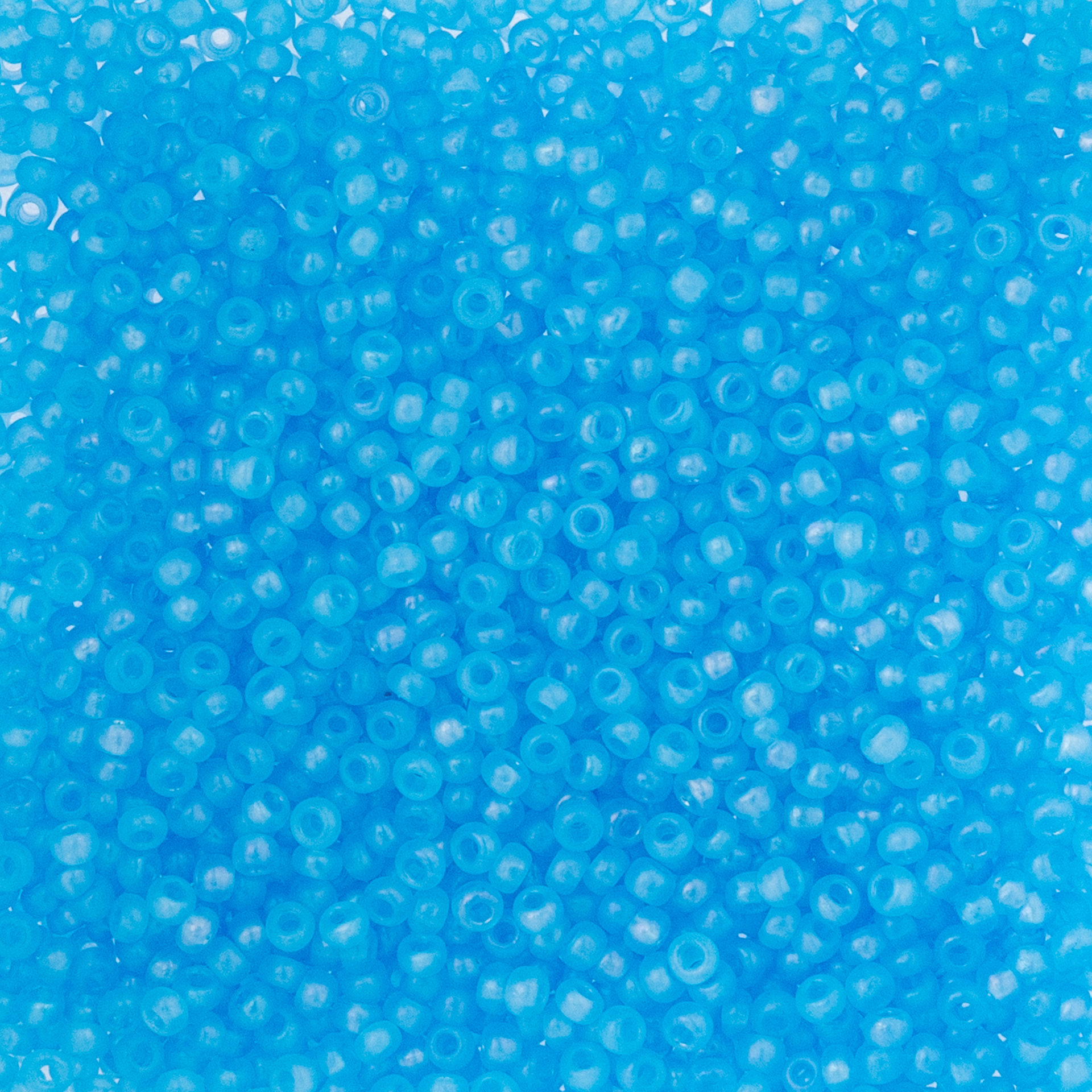 John Bead Czech Glass Seed Beads - Transparent Aqua Rainbow AB, 10/0, 22 g Vial close up
