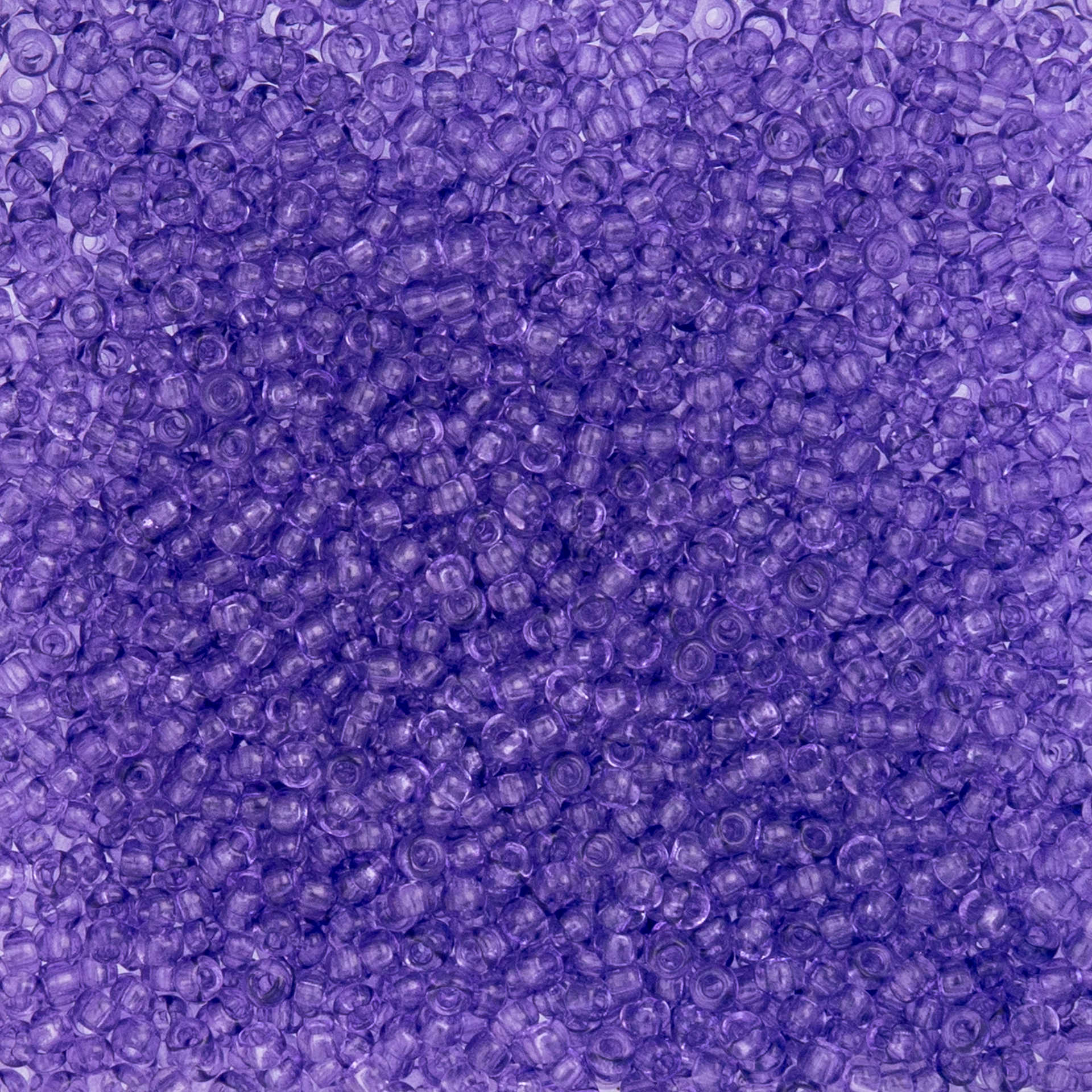 John Bead Czech Glass Seed Beads - Transparent Tanzanite, 10/0, 22 g Vial close up