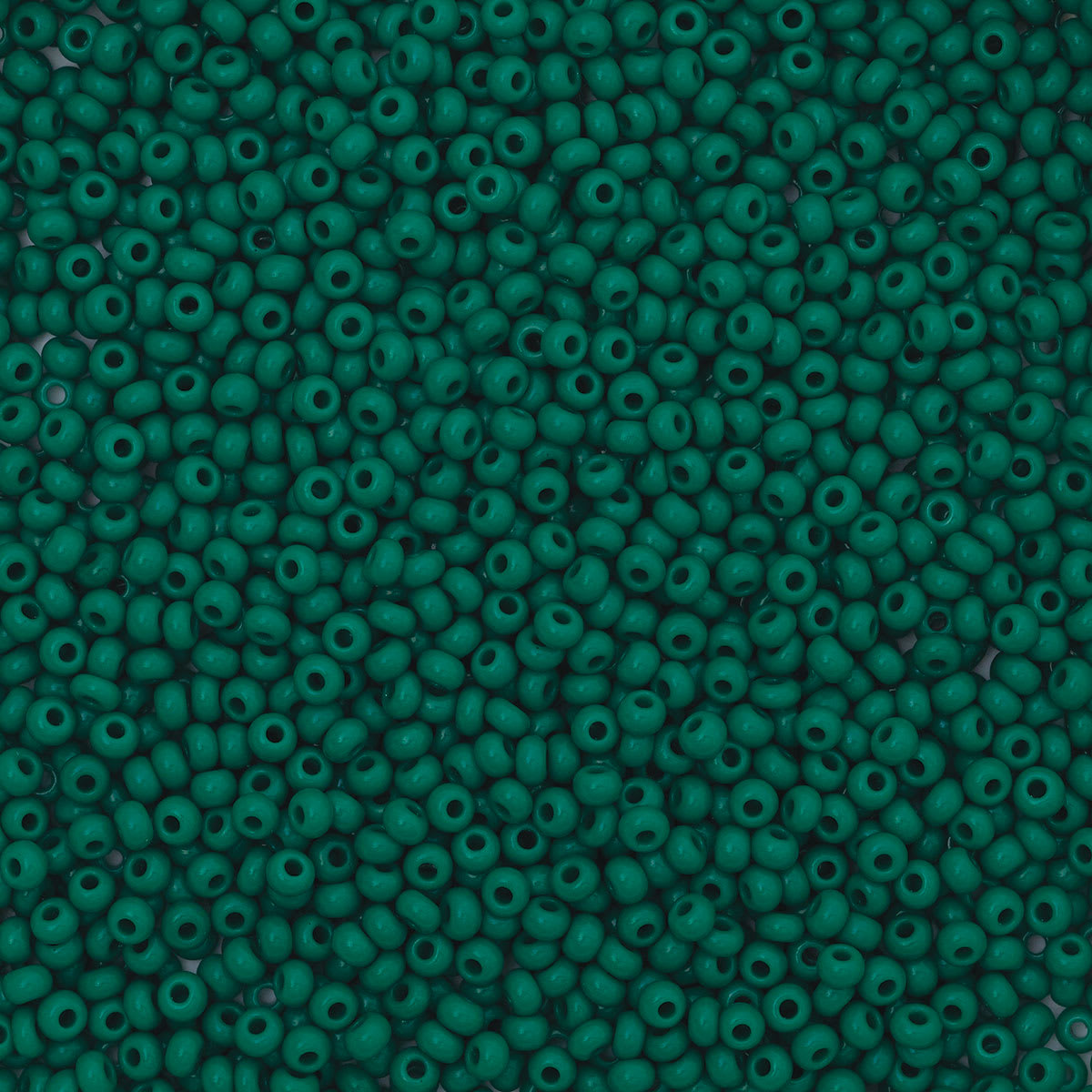 John Bead Czech Glass Seed Beads - Dark Green, 10/0, 22 g Vial close up