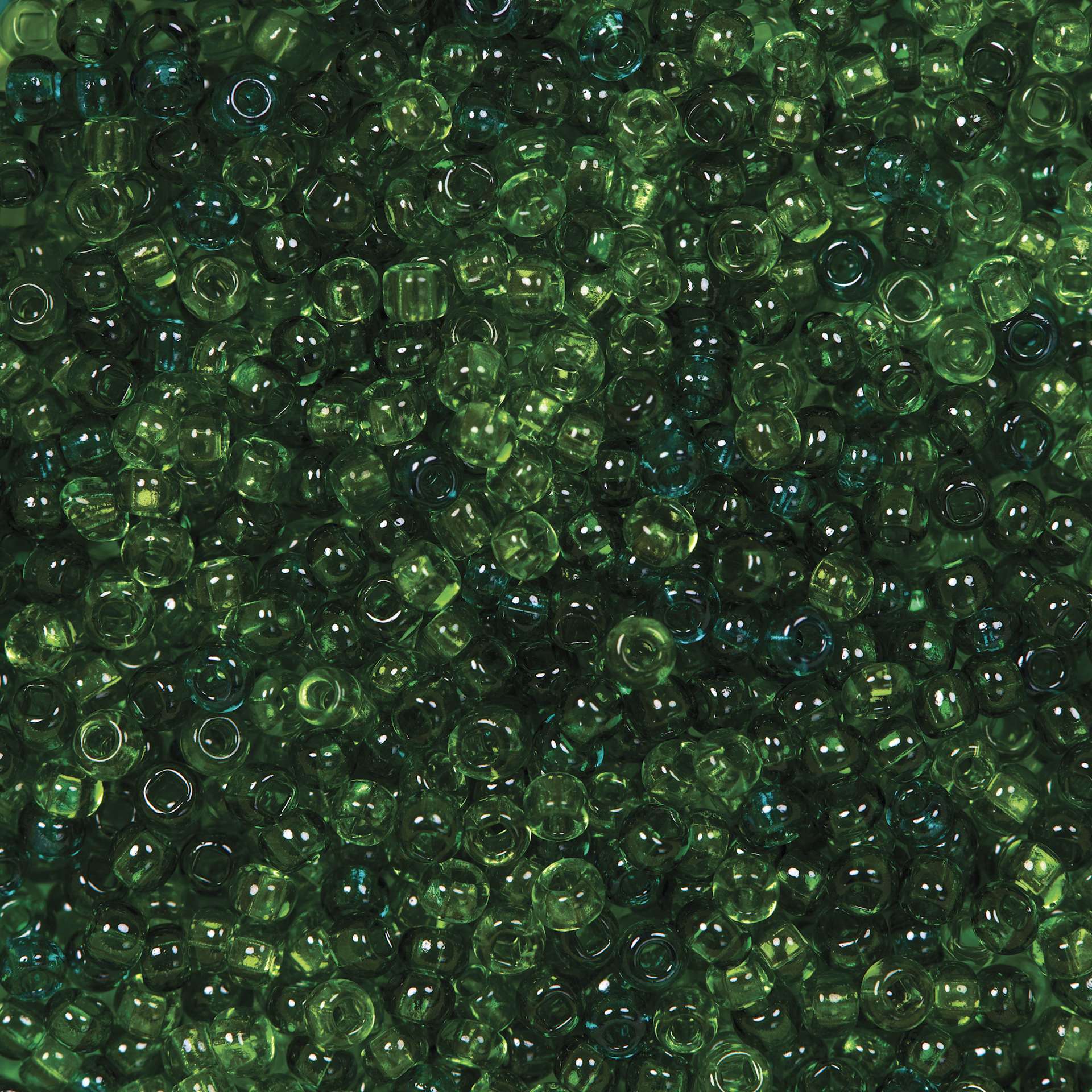 John Bead Czech Glass Seed Beads - Transparent Sea Green, Luster Mix, 10/0, 22 g Vial close up