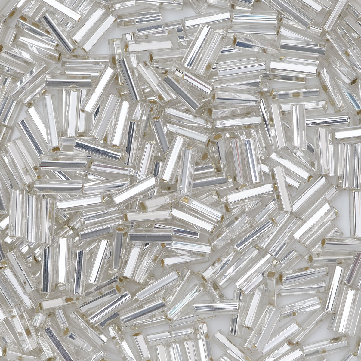 John Bead Czech Glass Seed Beads - Bugle Style, Crystal, 10/0, 22 g Vial close up