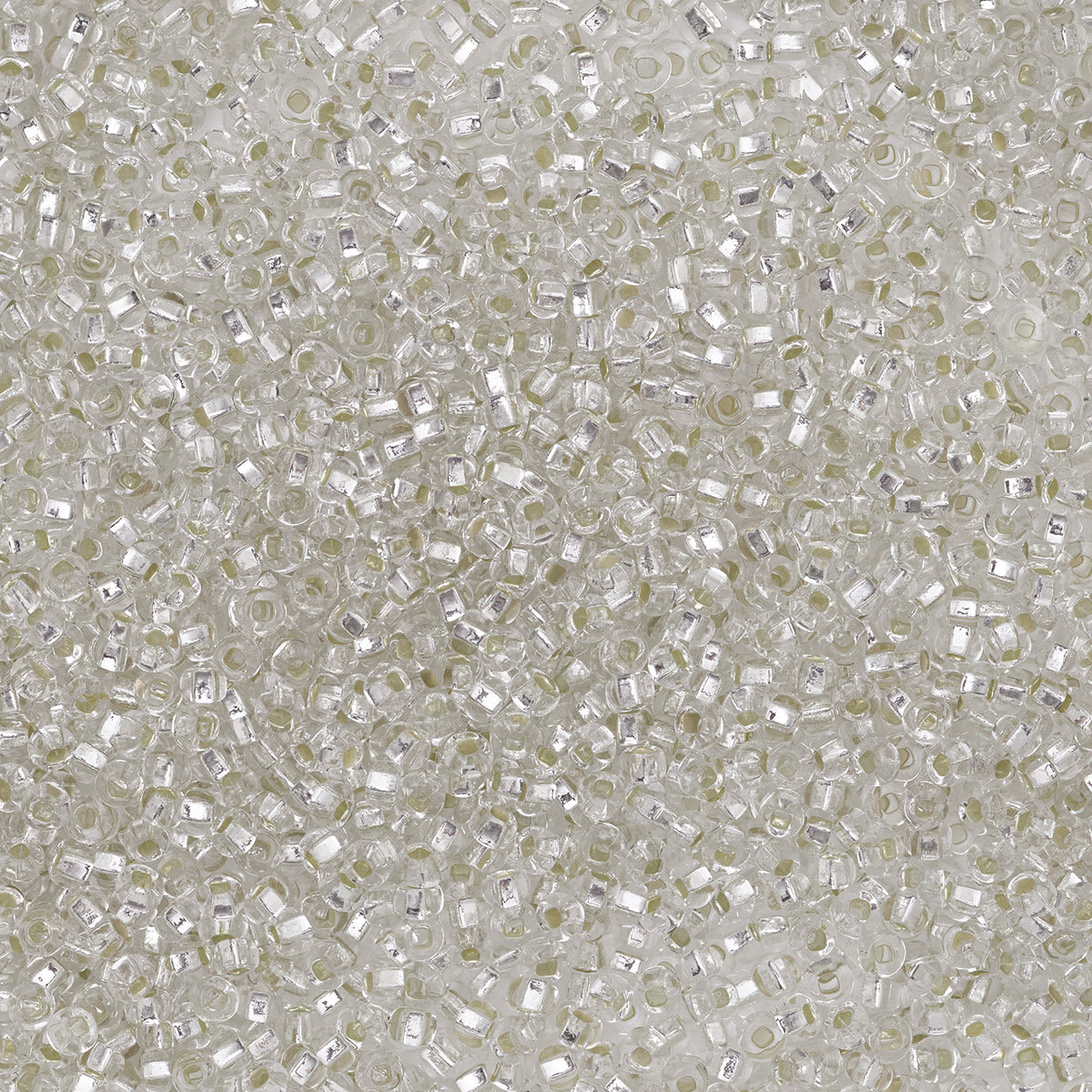 John Bead Czech Glass Seed Beads - Crystal, Silver Lined, 10/0, 22 g Vial close up