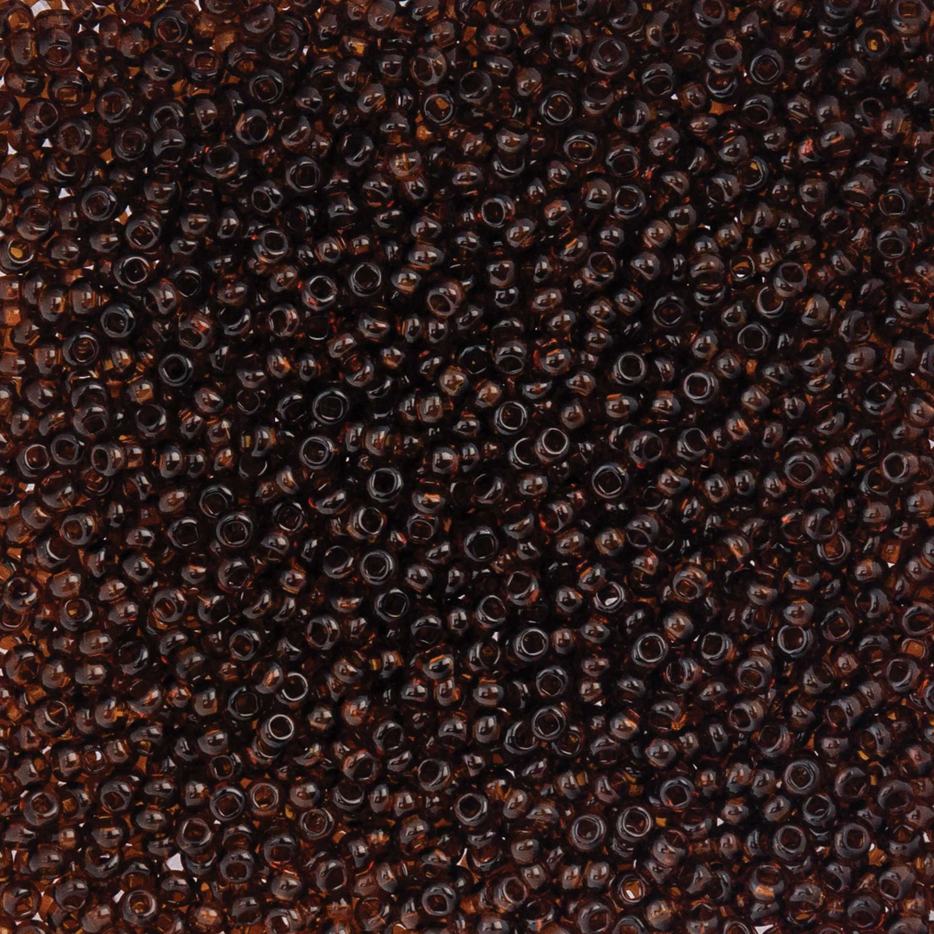 John Bead Czech Glass Seed Beads - Transparent Brown, 10/0, 22 g Vial close up