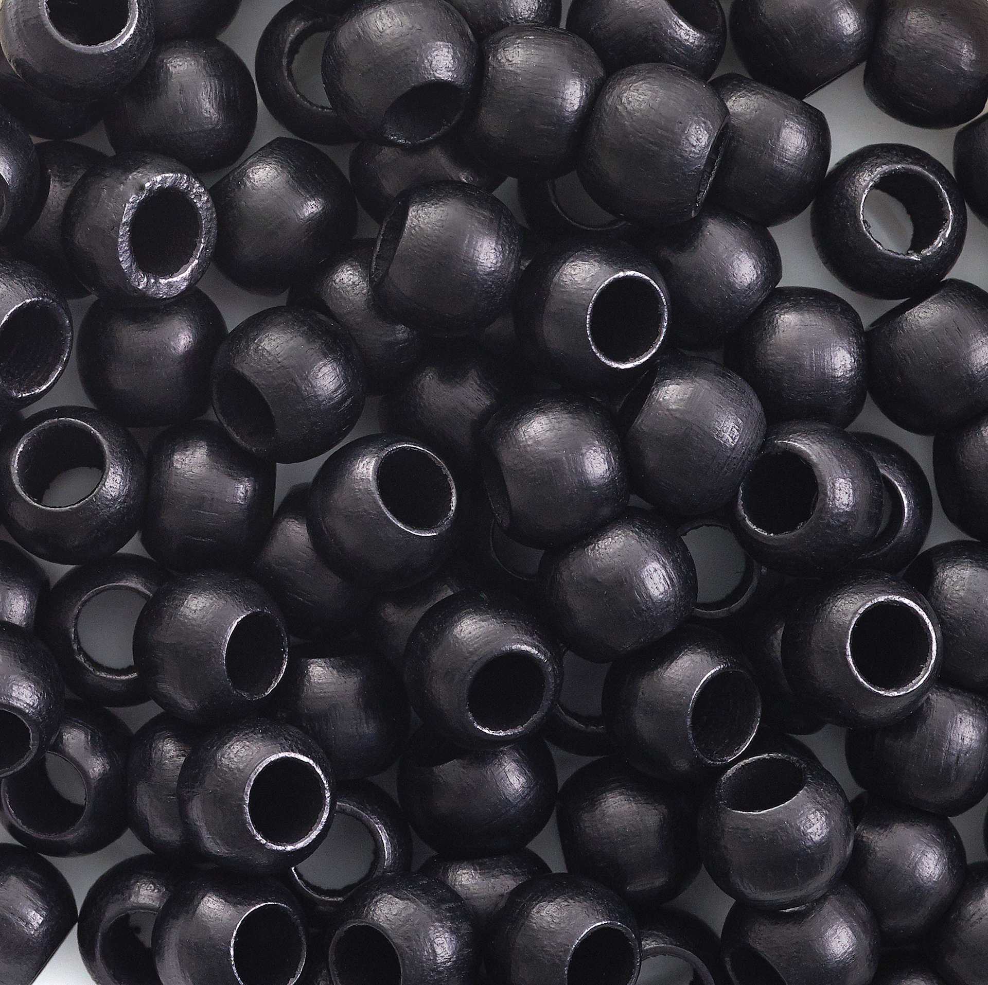 John Bead Euro Wood Beads - Black, Round Large Hole, 8 mm x 6.5 mm, Pkg of 100 - close-up of beads