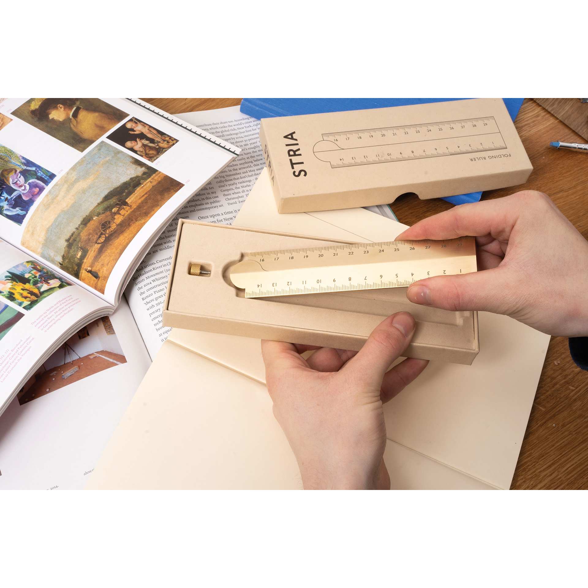 Makers Cabinet Stria Folding Ruler - 30 cm, held in hands