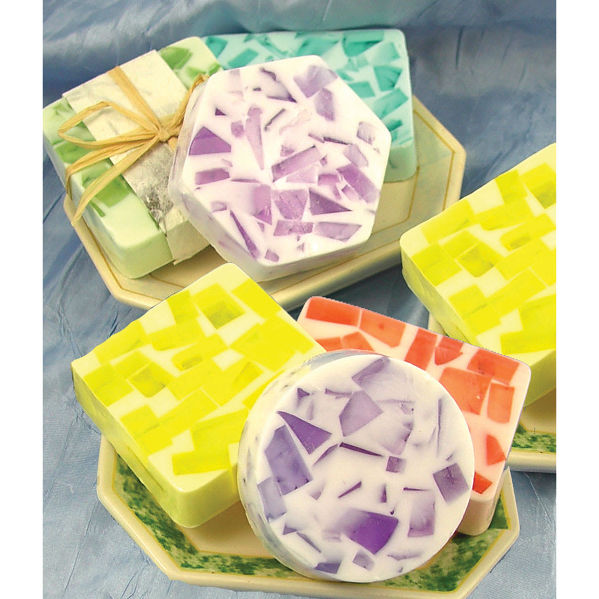 Life of the Party Soap Bases - Several finished soaps in small soap dishes