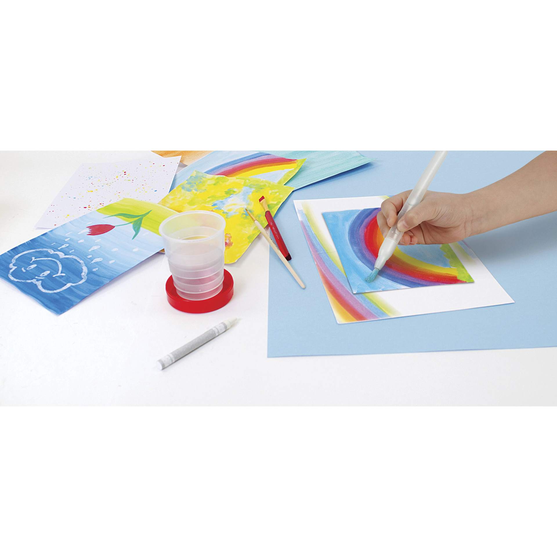 Faber-Castell Young Artist Learn to Watercolor Set -
Child's hand painting with water brush