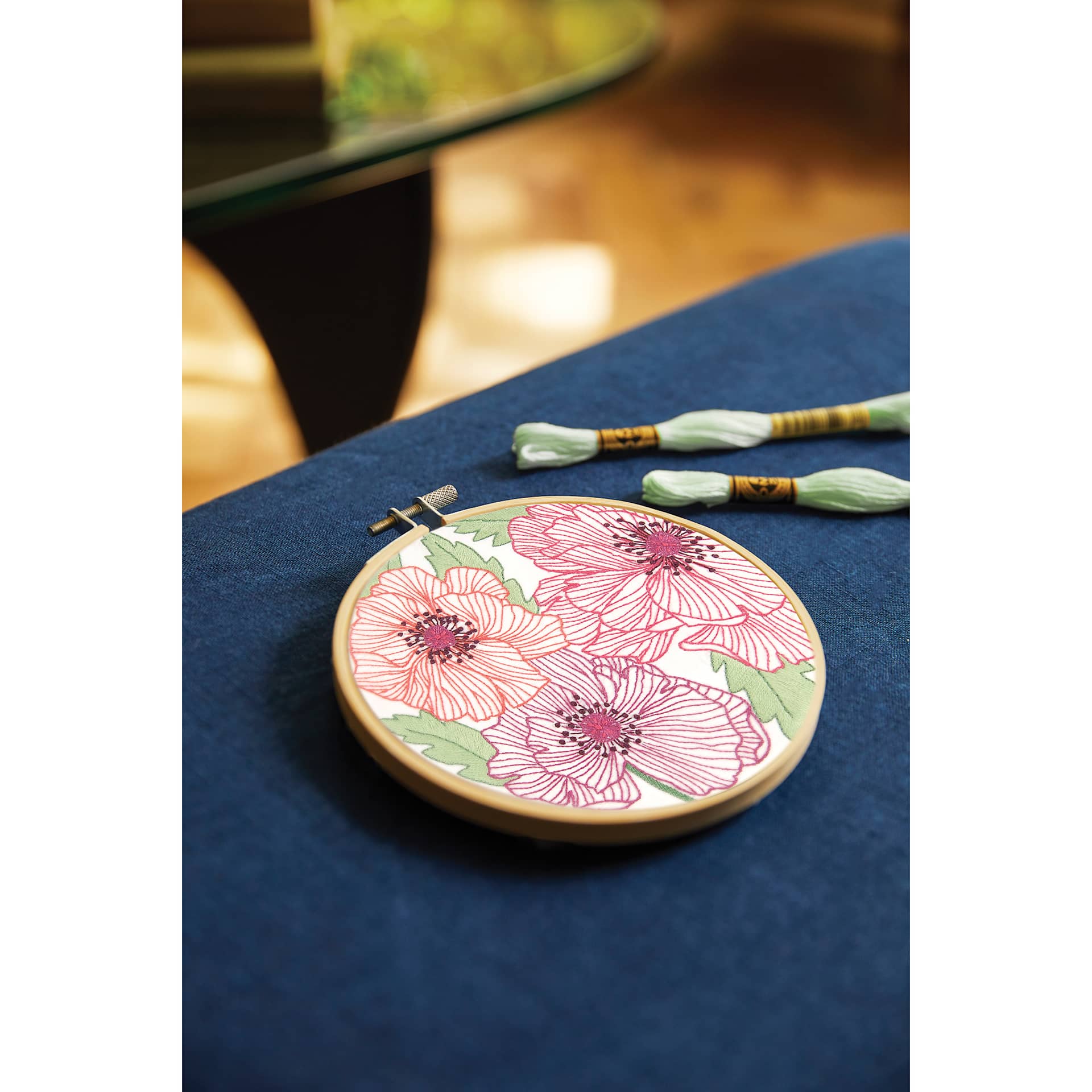 DMC The Designer Collection Embroidery Kits - “Poppies” by Nathalie Weinzaepf, Intermediate finished example on table