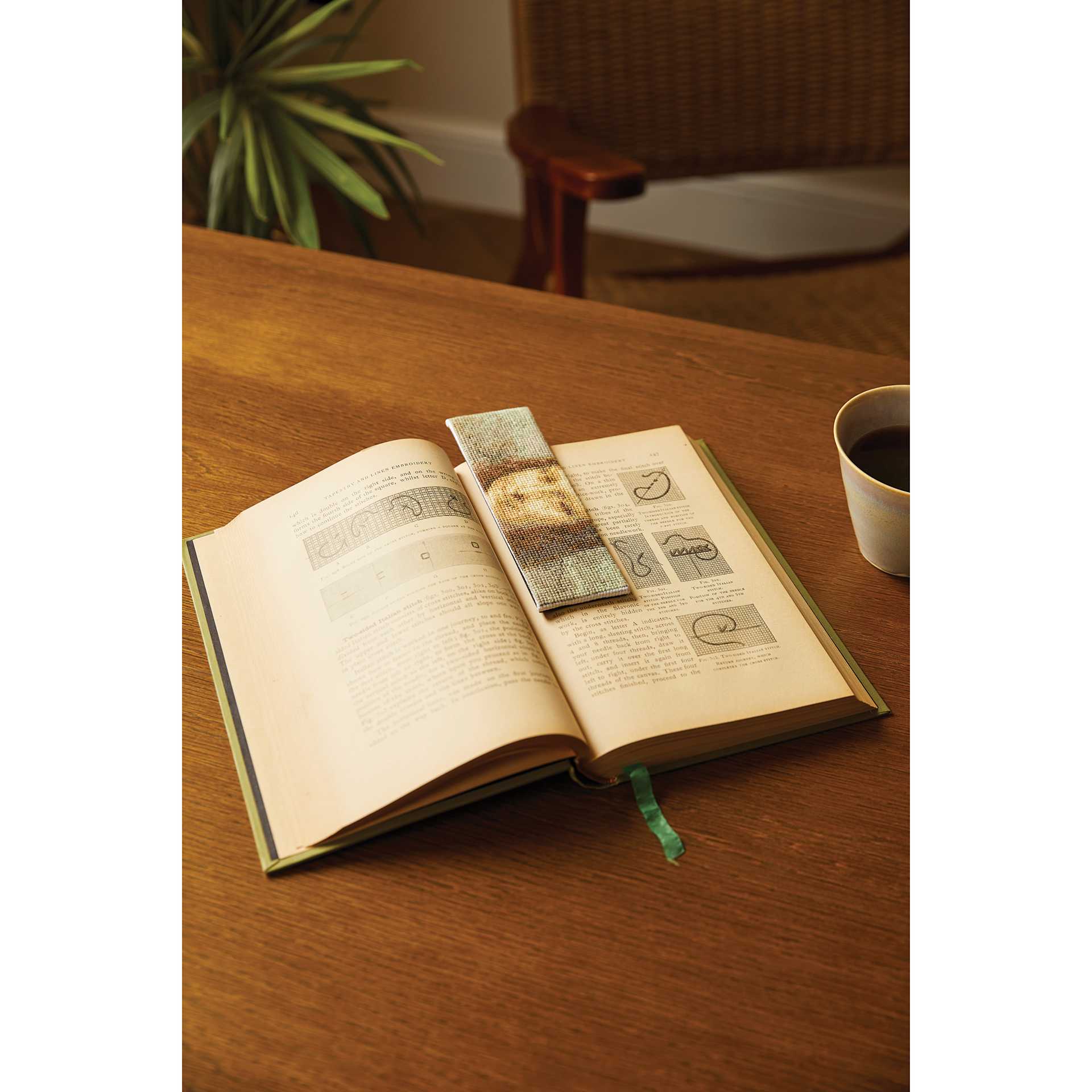 DMC The Masters Collection Cross Stitch Bookmark Kit - "Mona Lisa" by Da Vinci finished, in a book