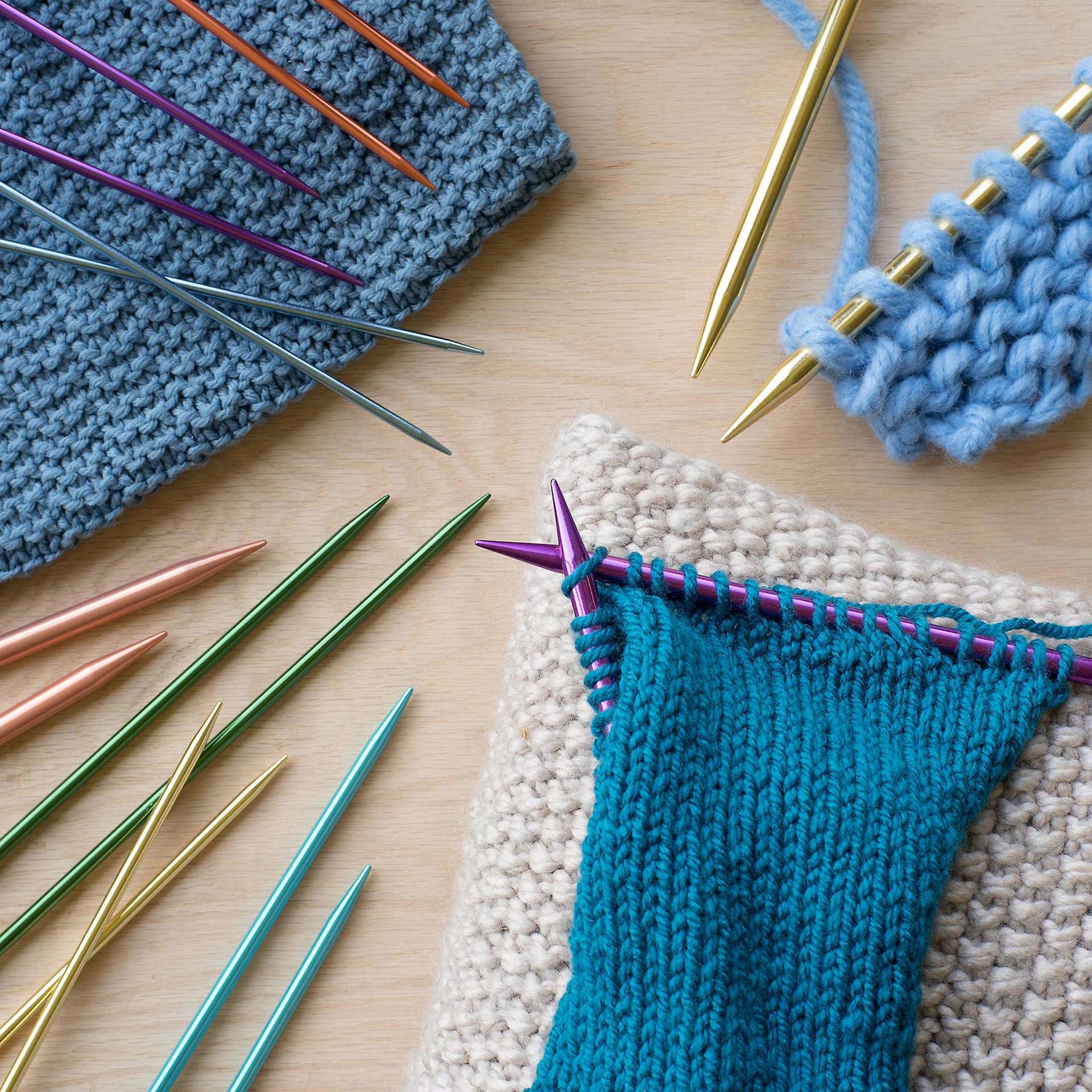 Boye Aluminum Knitting Needles - assortment near in progress project examples (yarn not included)
