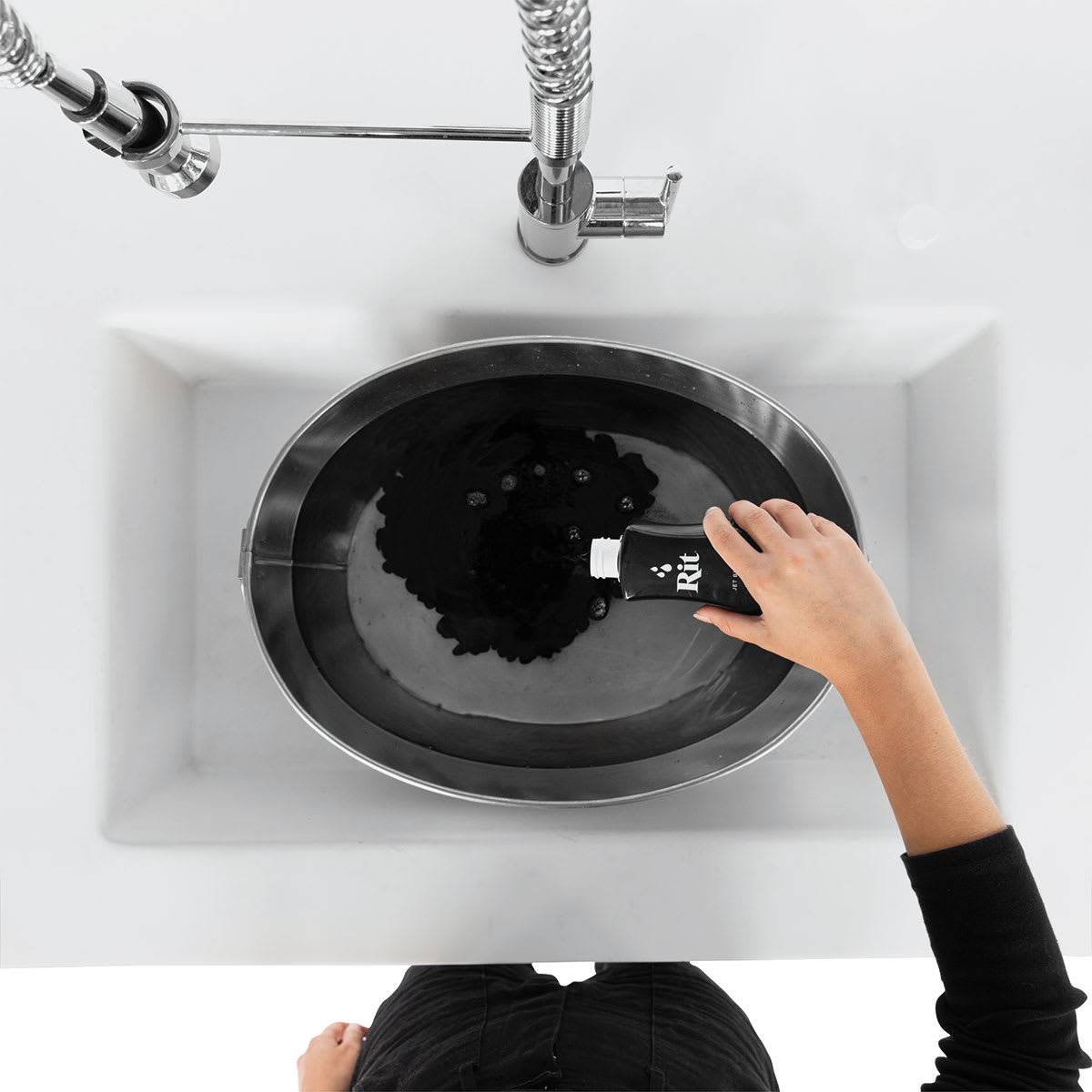 Rit Back to Black Dye Kit - Overhead view of dye being poured into sink