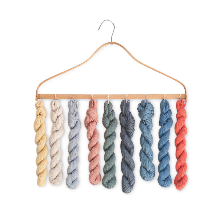 Quince & Co Kestrel Yarn - assorted colors on display hanger